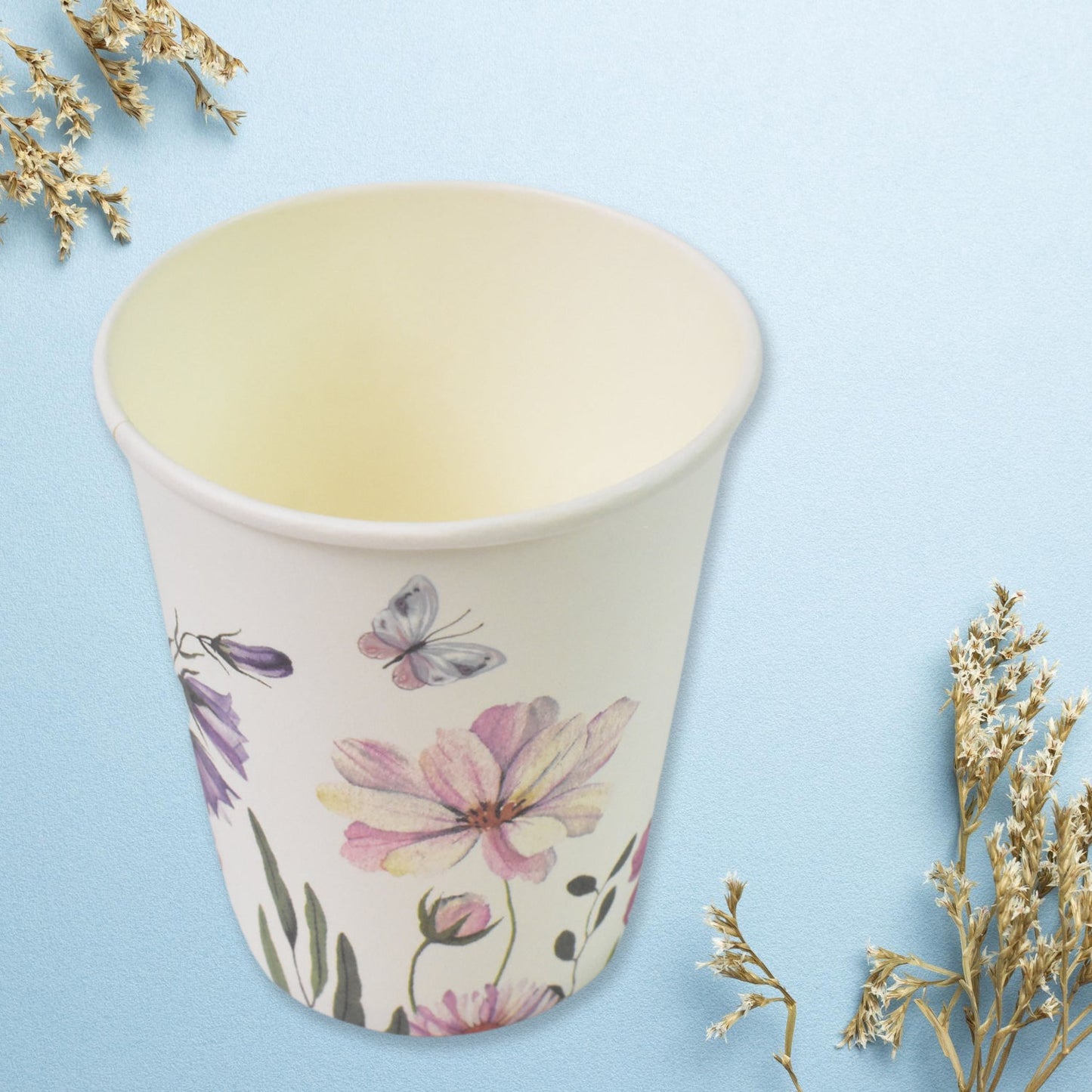 Assortment of disposable paper cups showcasing different patterns.