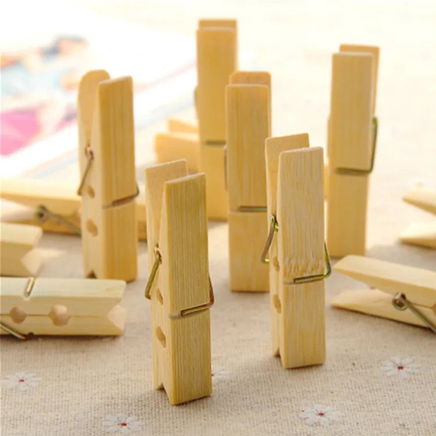 Close-up of durable wooden clothespins with strong steel springs for various tasks.