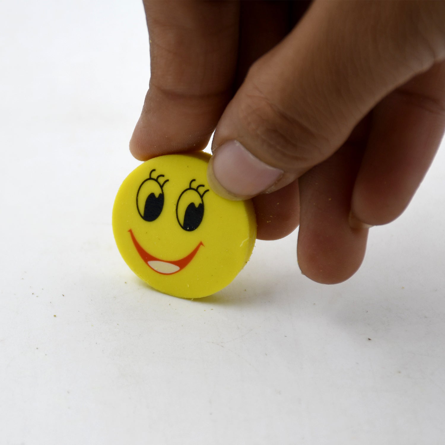 Bright and colorful smiley face erasers for children's stationery collection.