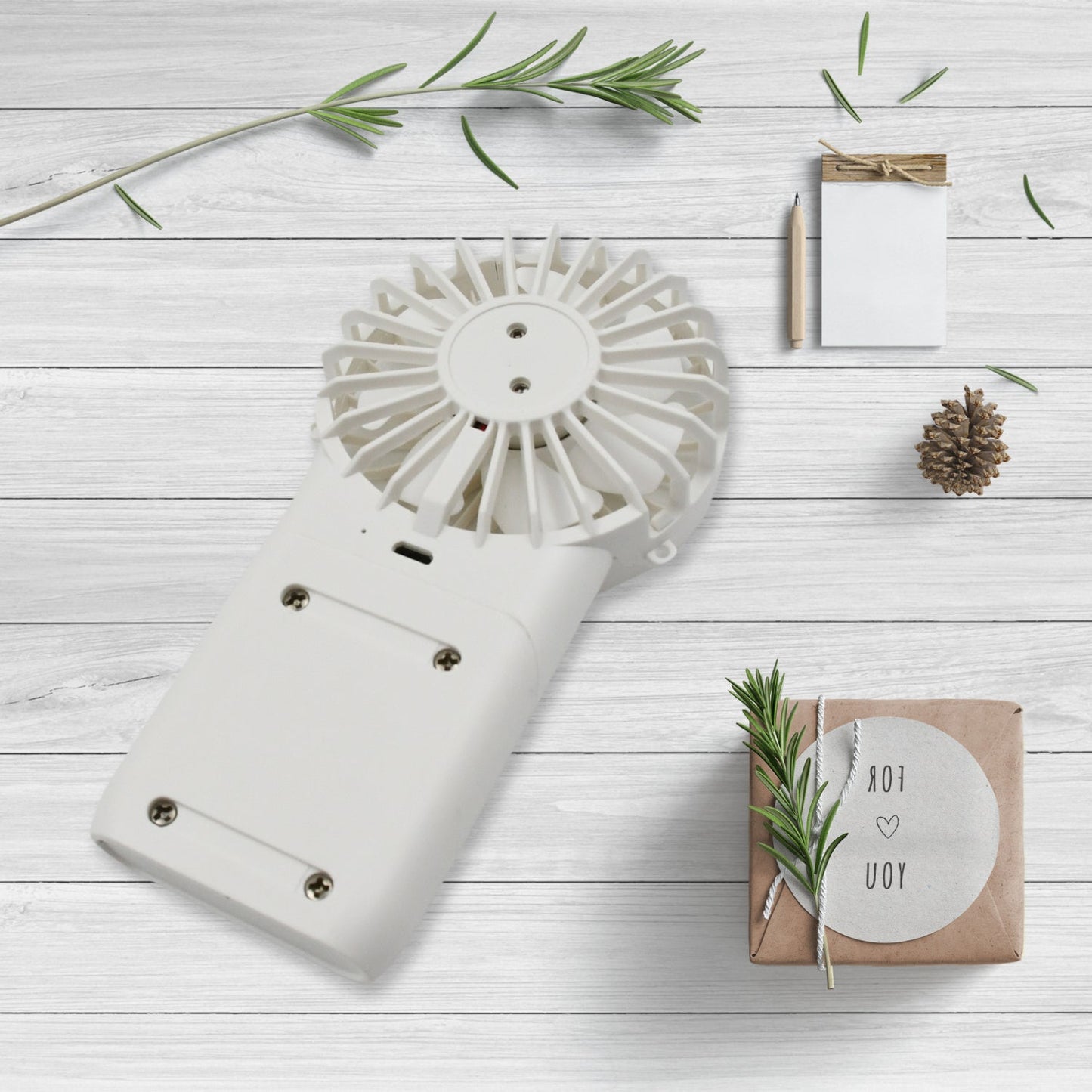 Close-up of the simple one-button control on the portable personal fan.