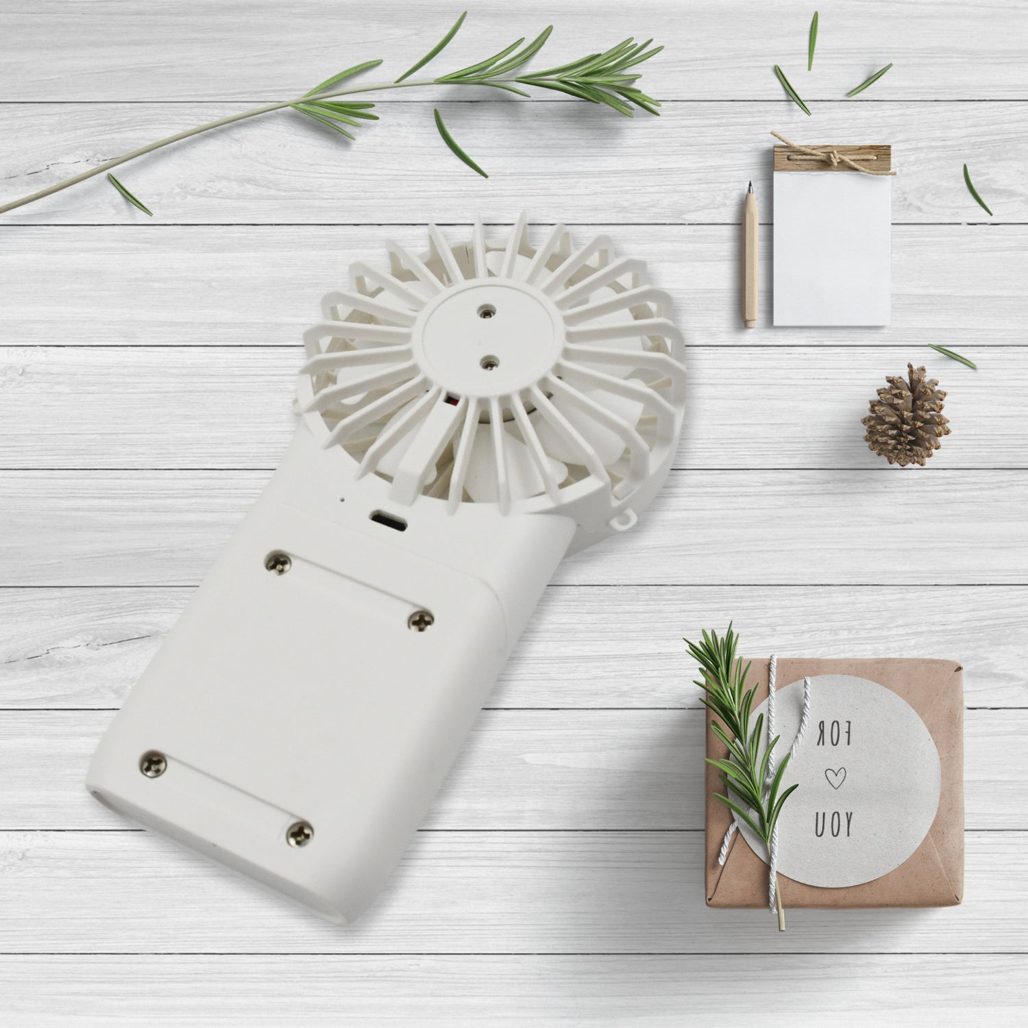 Close-up of the simple one-button control on the portable personal fan.