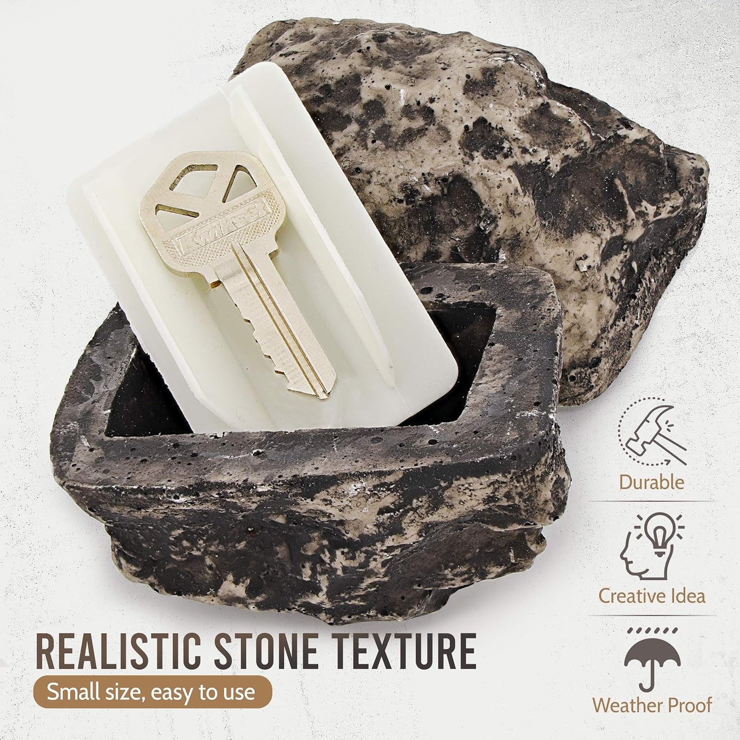 A standard house key discreetly hidden inside the fake rock key hider.