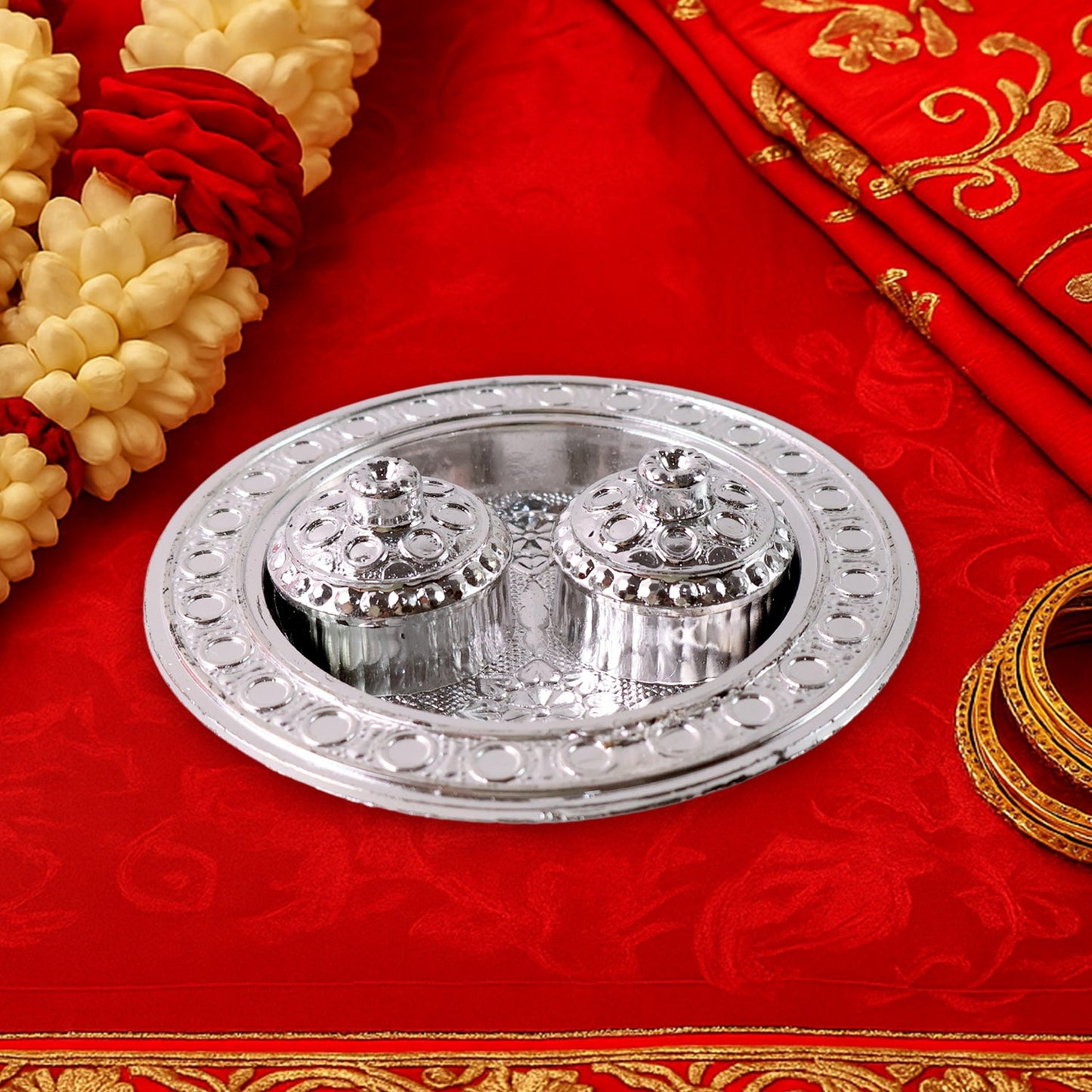 The small Kumkum Thali Holder filled with vibrant haldi and kumkum powder.