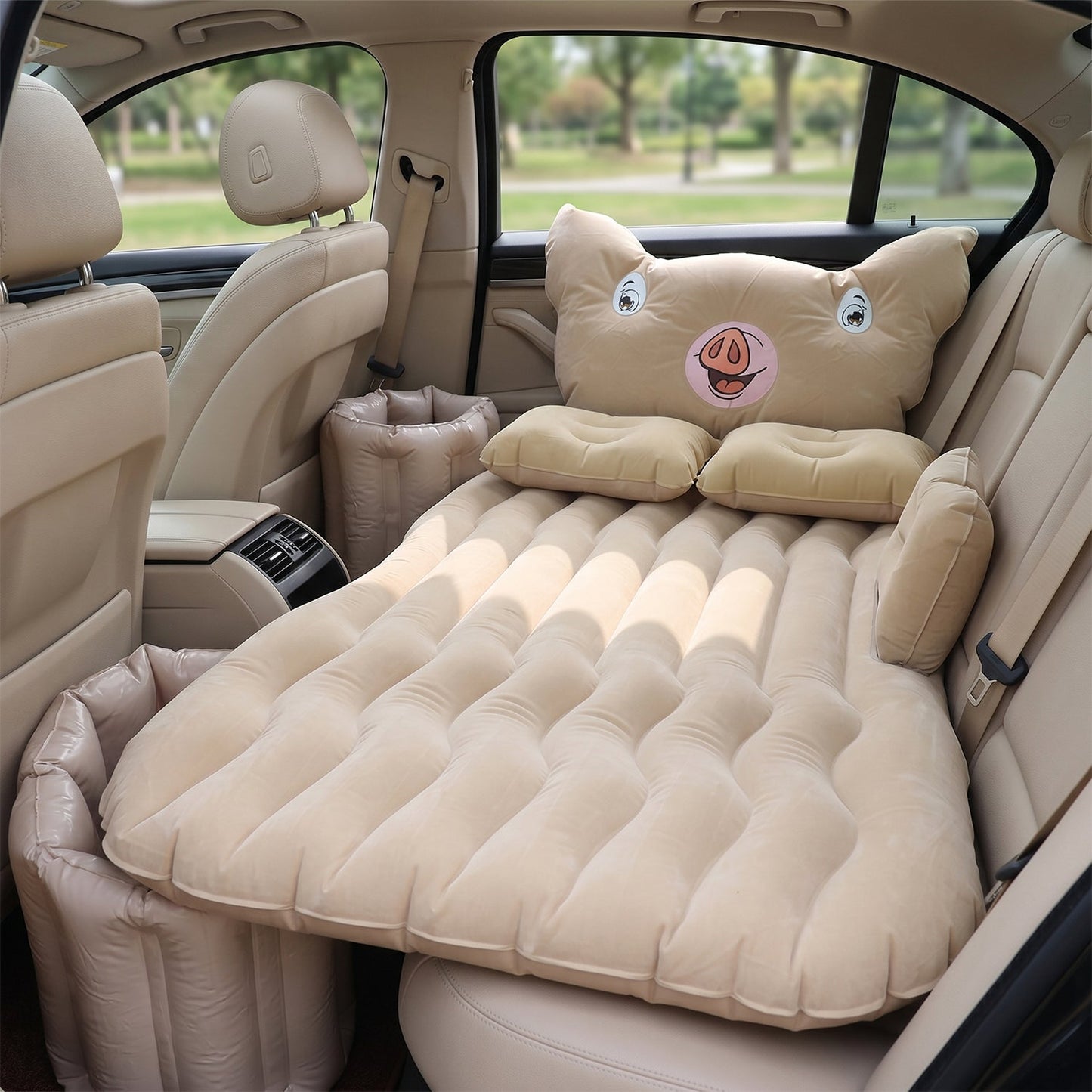 Inflatable car mattress installed in sedan back seat for travel