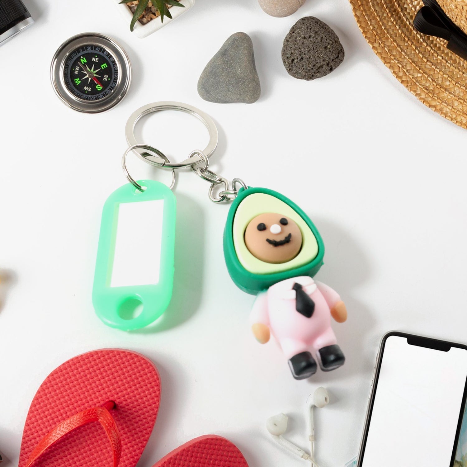Cartoon keychain accessory featuring avocado character and metal keyring