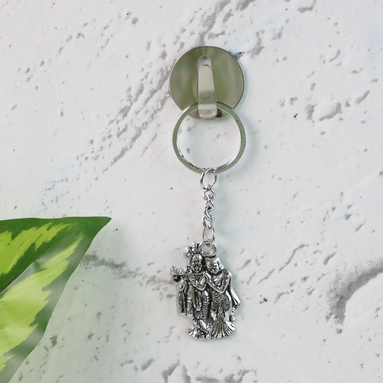 Detailed view of durable metal Radha Krishna keychain with ornate craftsmanship