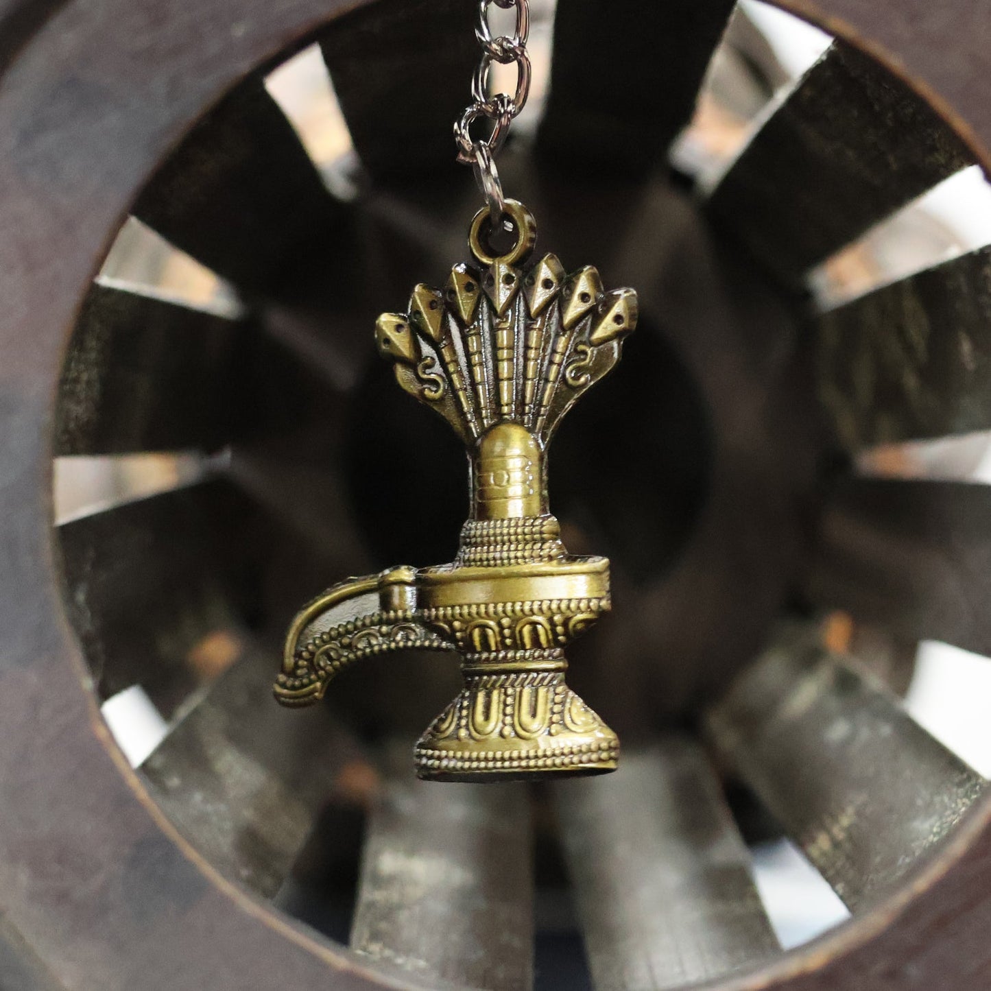 Metal keychain featuring Lord Shiva Shivaling with serpent motif
