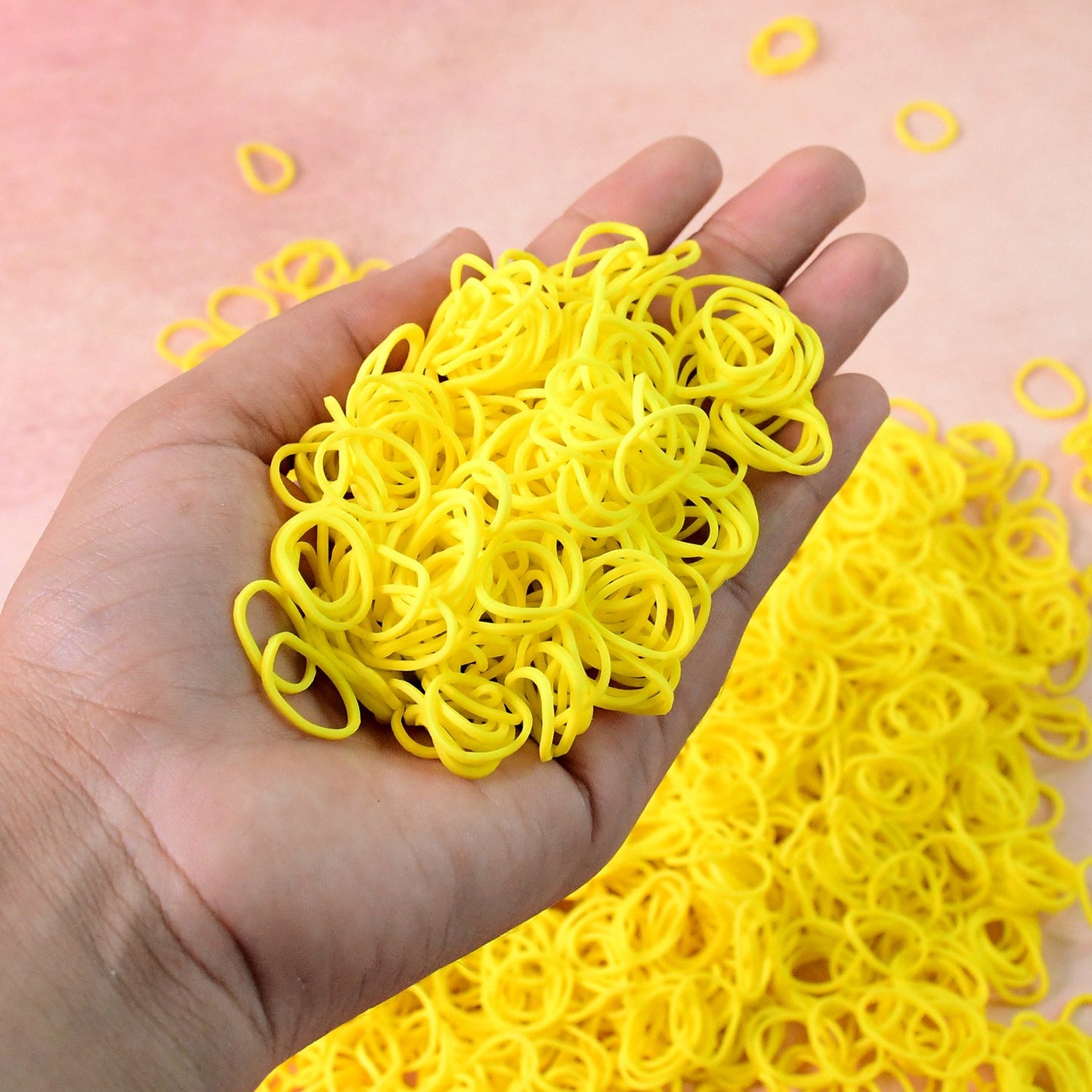 Set of reusable strong elastic rubber bands in orange color