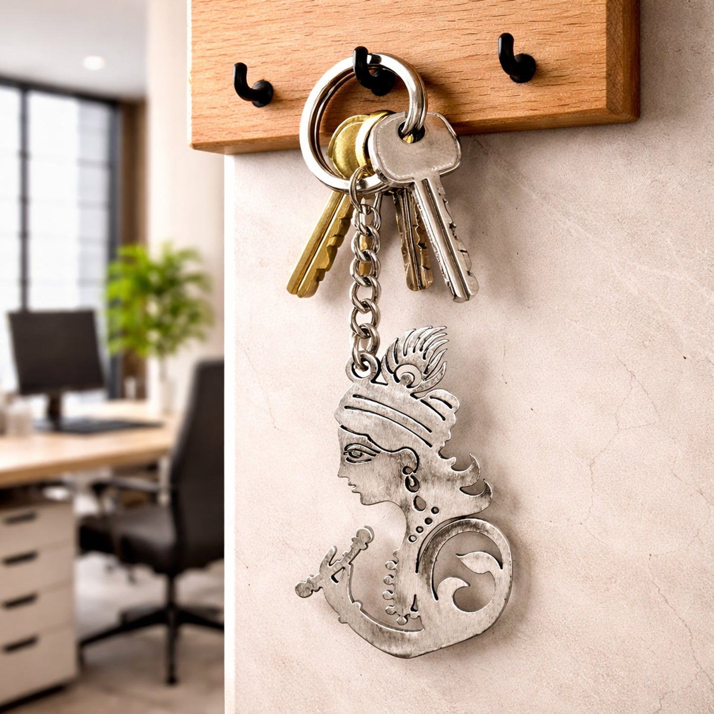 Spiritual metal Krishna key holder with intricate design