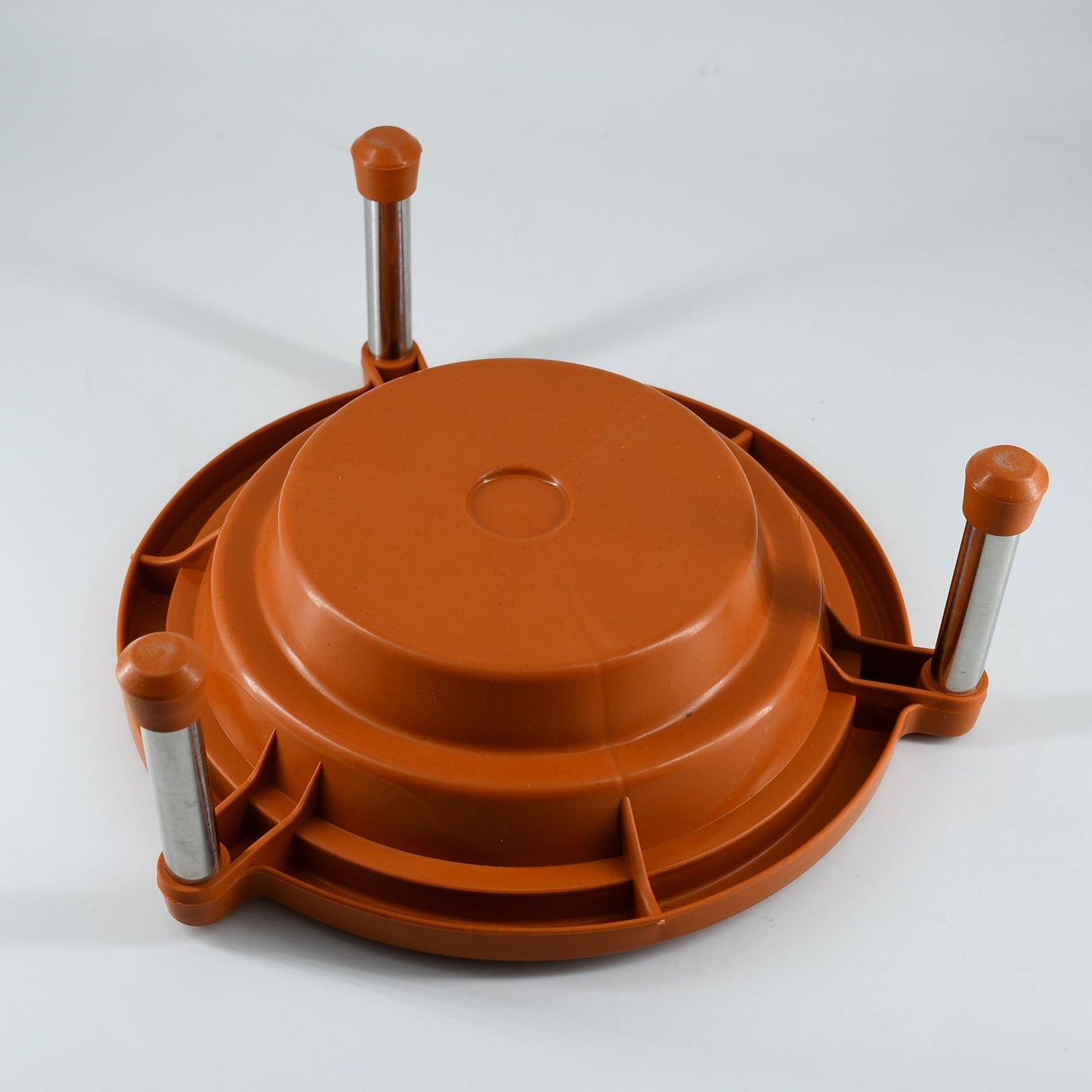 Versatile plastic stand holding a plant pot, enhancing kitchen decor.