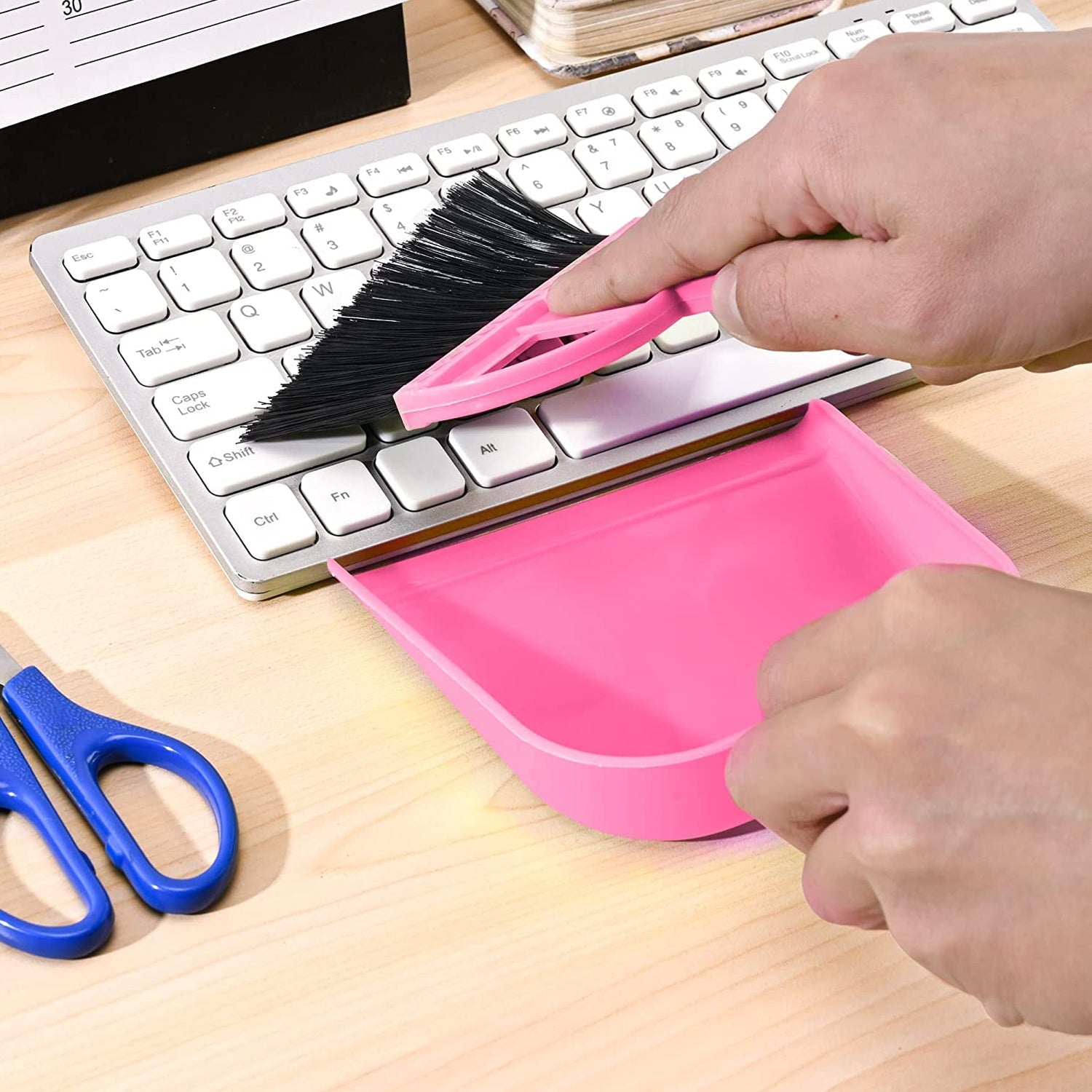 Lightweight dustpan with integrated brush, perfect for quick sweeping.