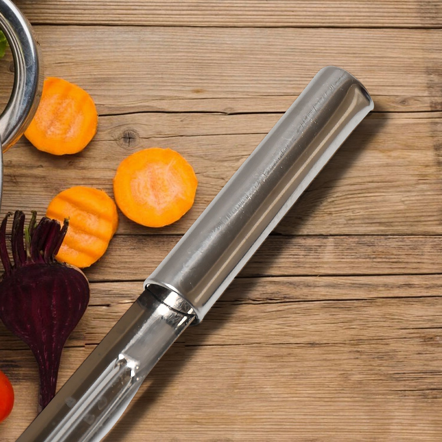 Detailed view of the sharpened, double-sided blades for versatile peeling and shredding.