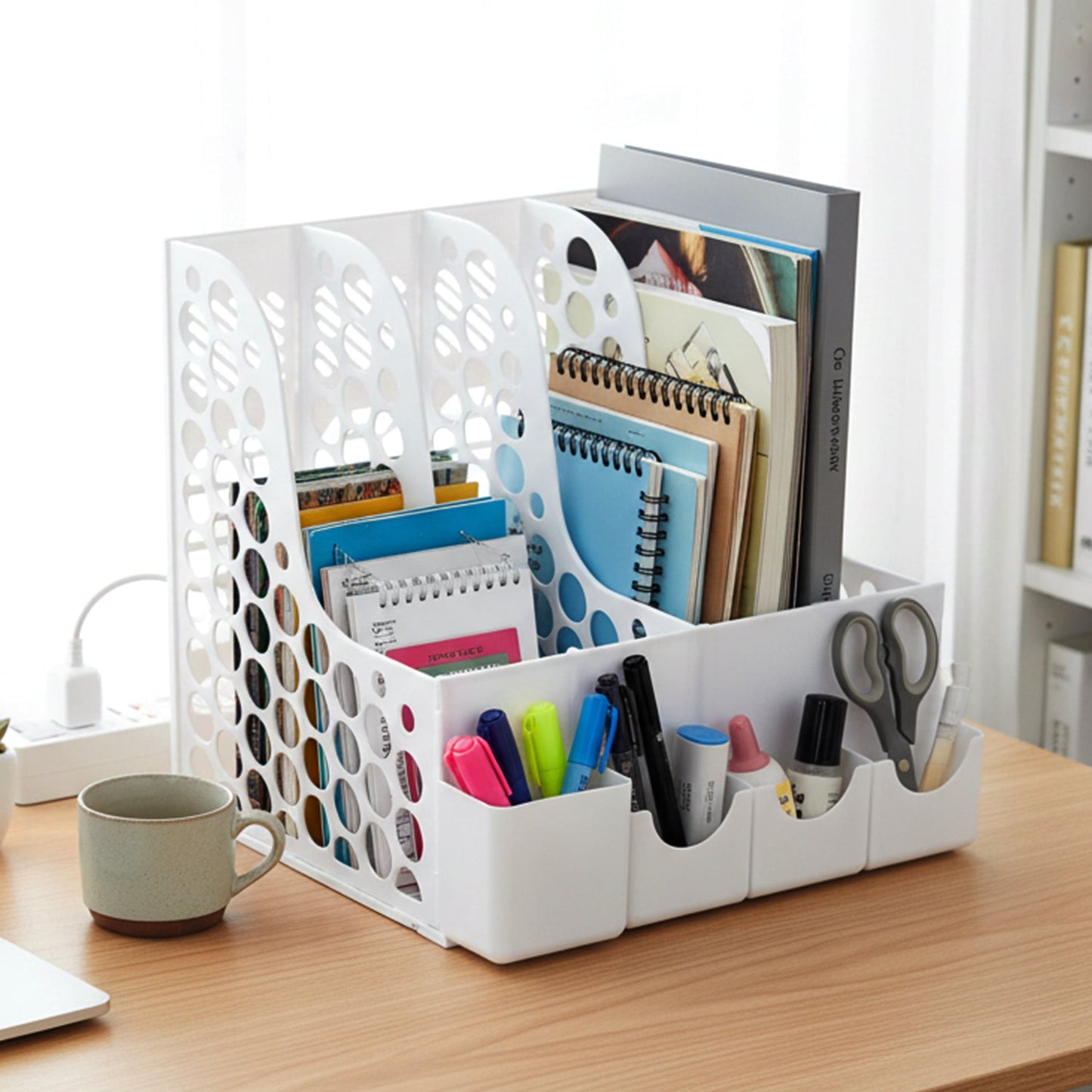 Front compartments of desk organizer for holding pens and stationery supplies.