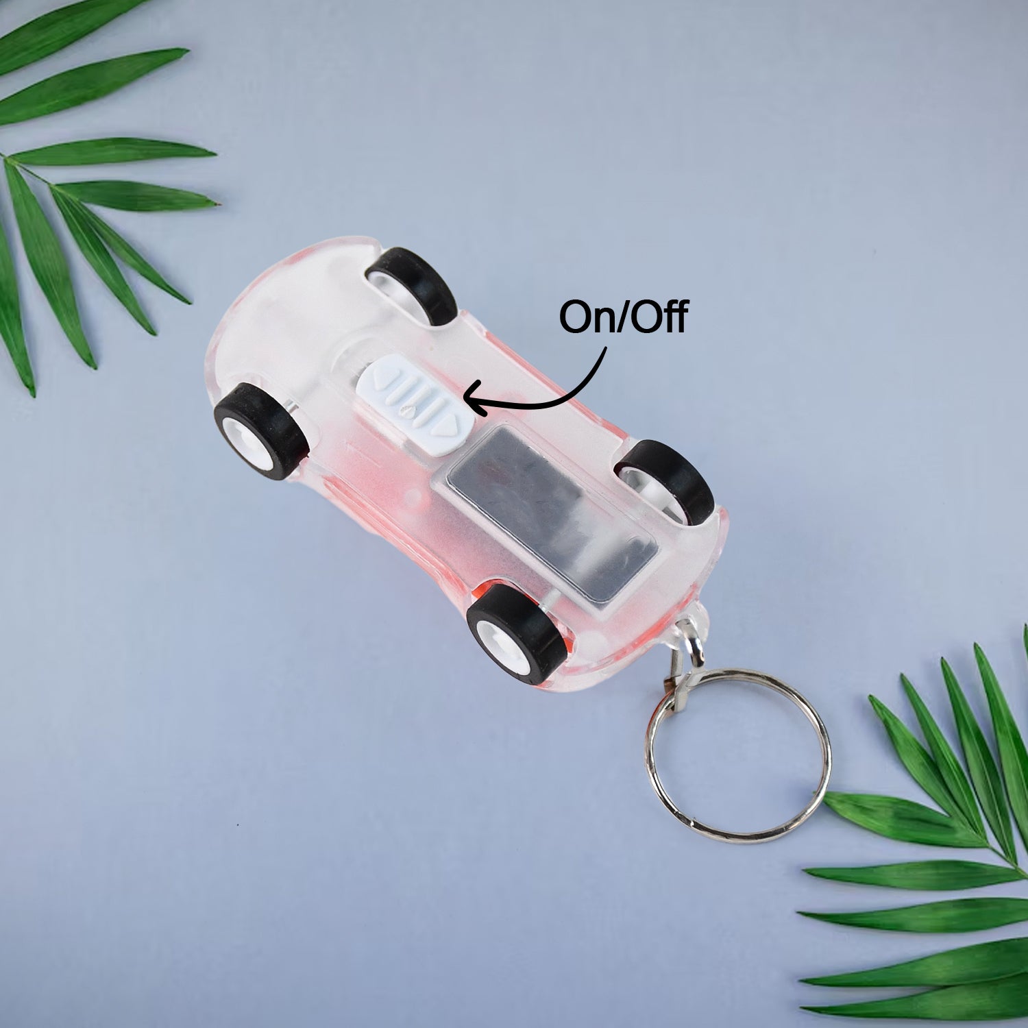 Illuminated Mini Car LED Keychain Light showing bright car headlights