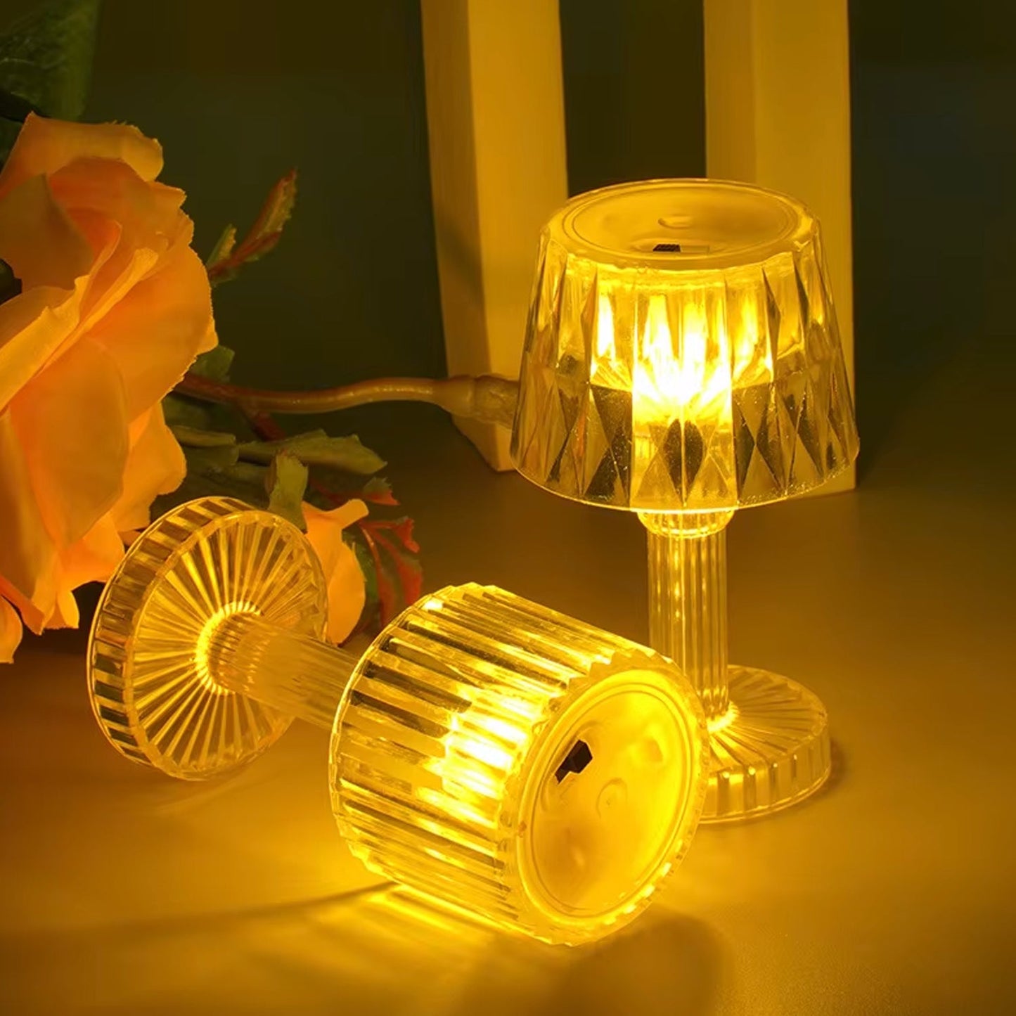 Six decorative LED mini table lamps glowing softly on a dining table setting.