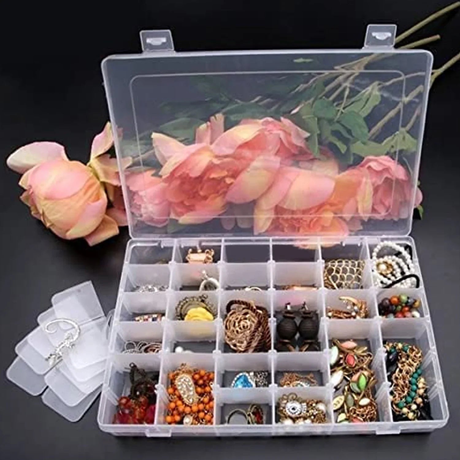 Clear plastic organizer box with 36 adjustable grids for versatile storage.