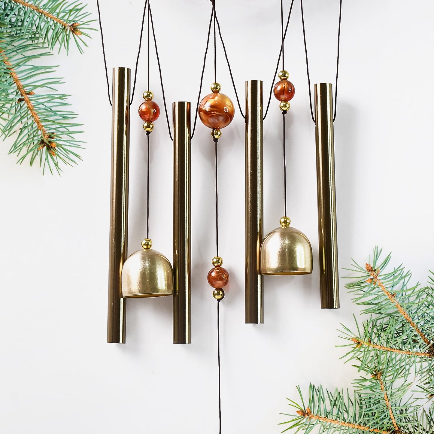 Lord Ganesh Wind Chimes displayed in garden setting creating peaceful ambiance