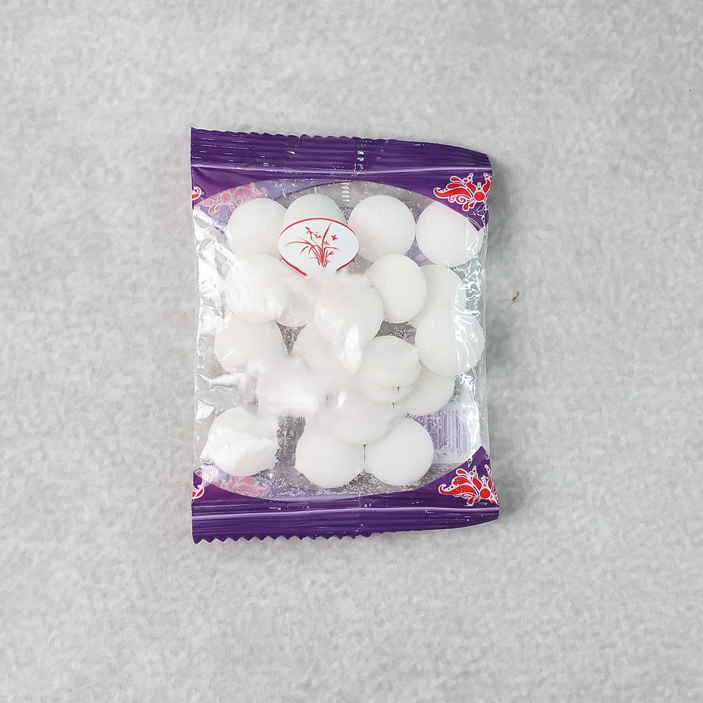 Close-up image of round naphthalene mothball tablets for wardrobe freshness