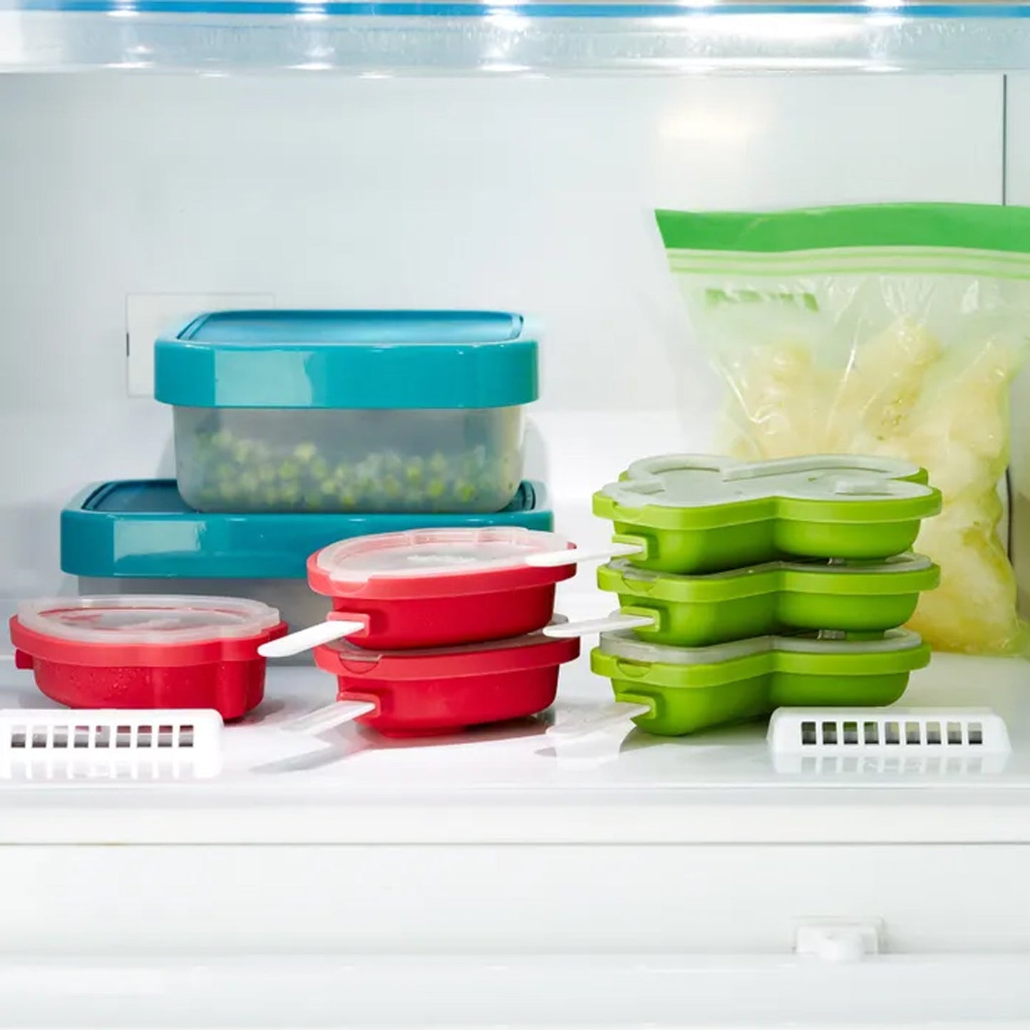 Three delicious, homemade cactus ice pops in different colors, fresh from the freezer.