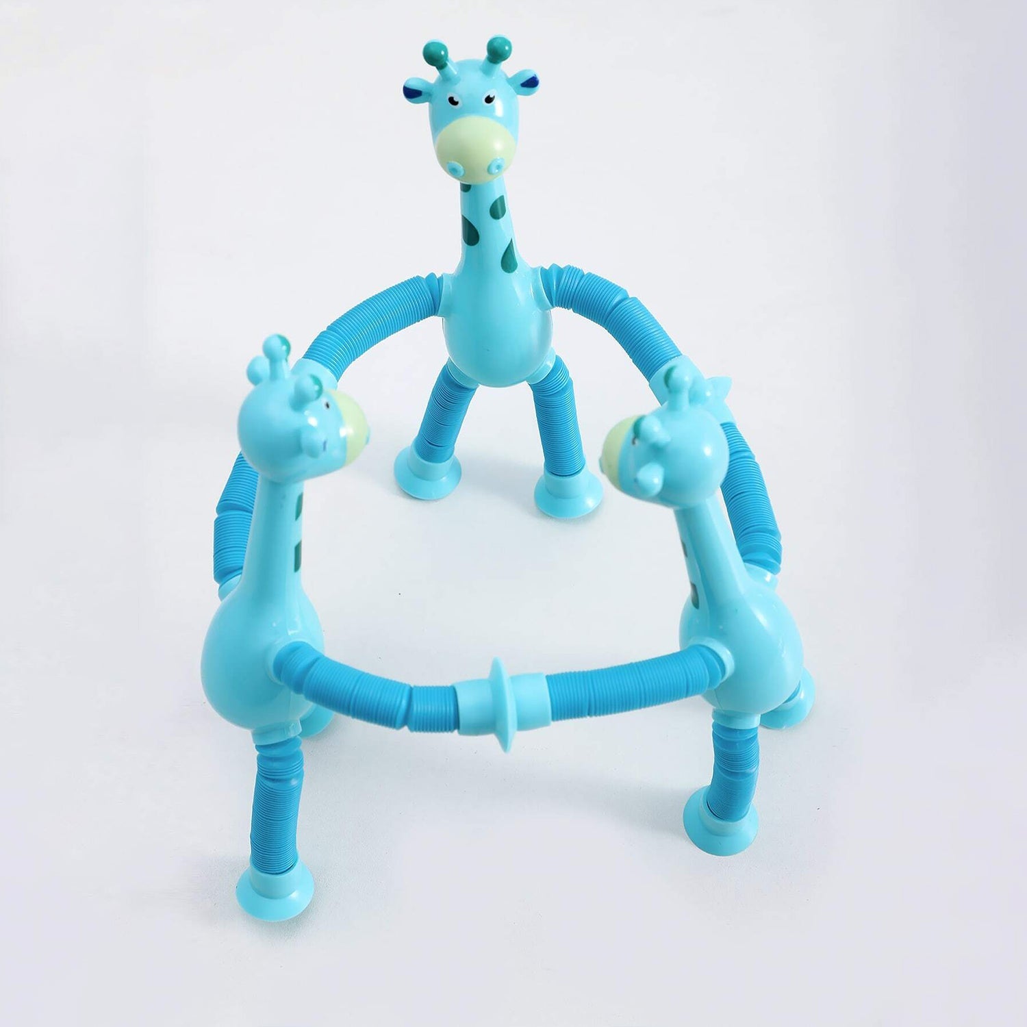 Multiple LED giraffe fidget toys stretched and twisted into various shapes.