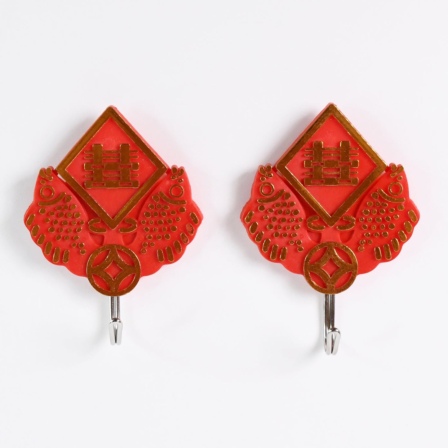 Close-up of a strong self-adhesive hook securely holding a bunch of keys.