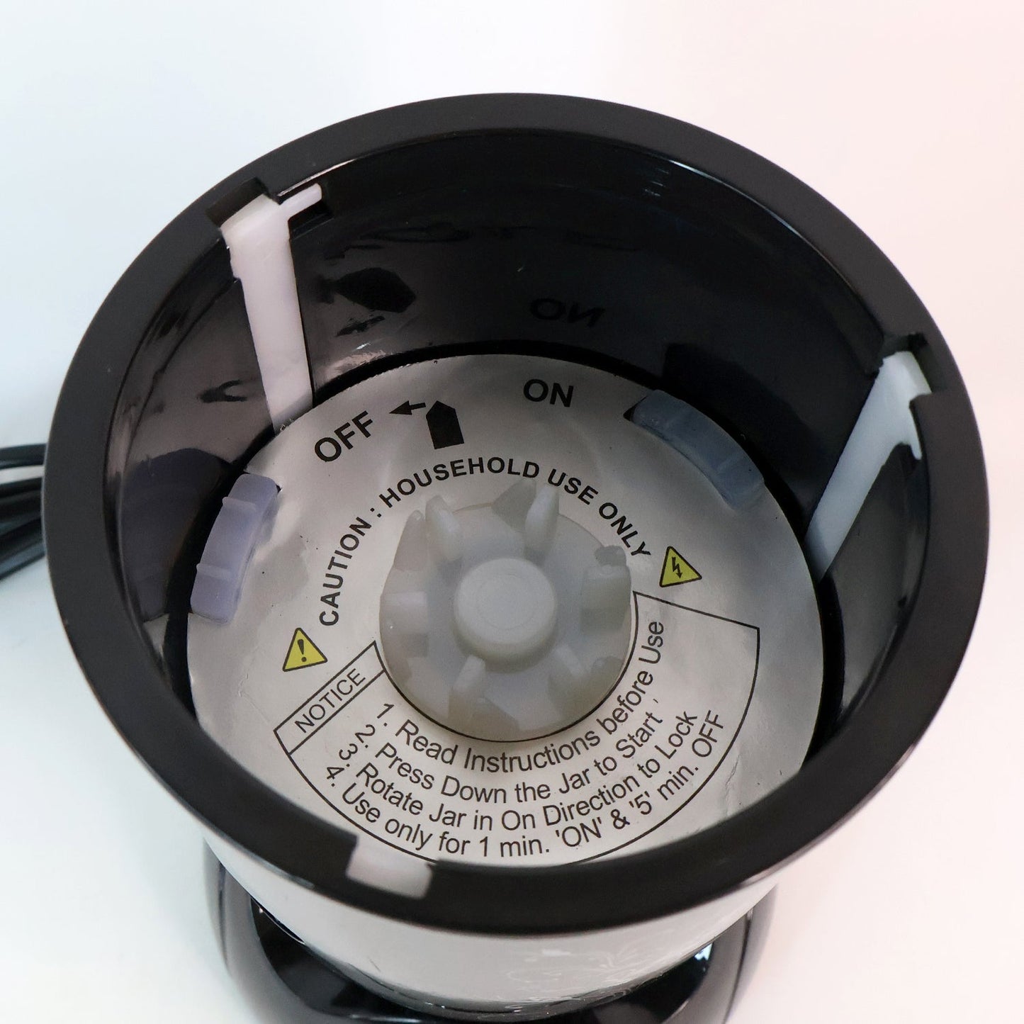 Close-up of stainless steel blades and jars of Orbit mixer grinder