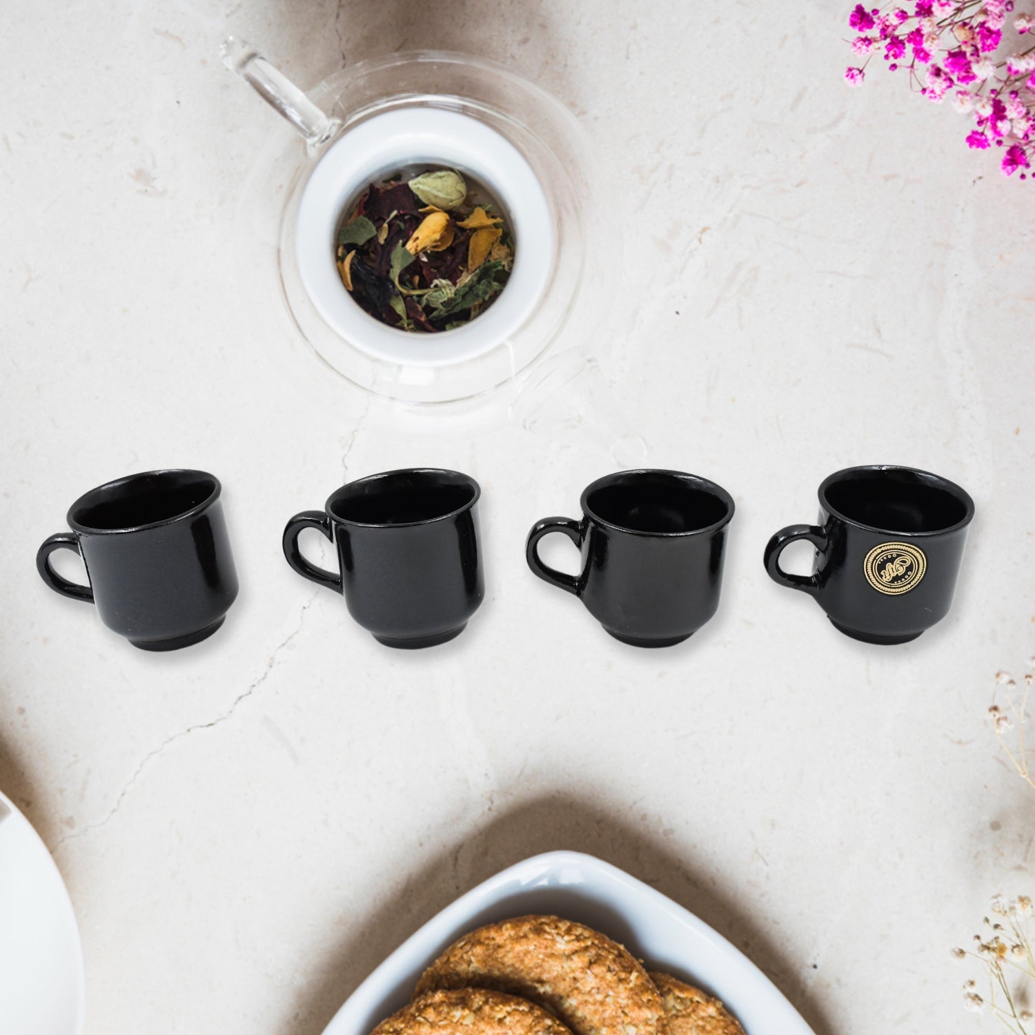 Pineapple design serving bowls filled with snacks, part of the ceramic tea set.