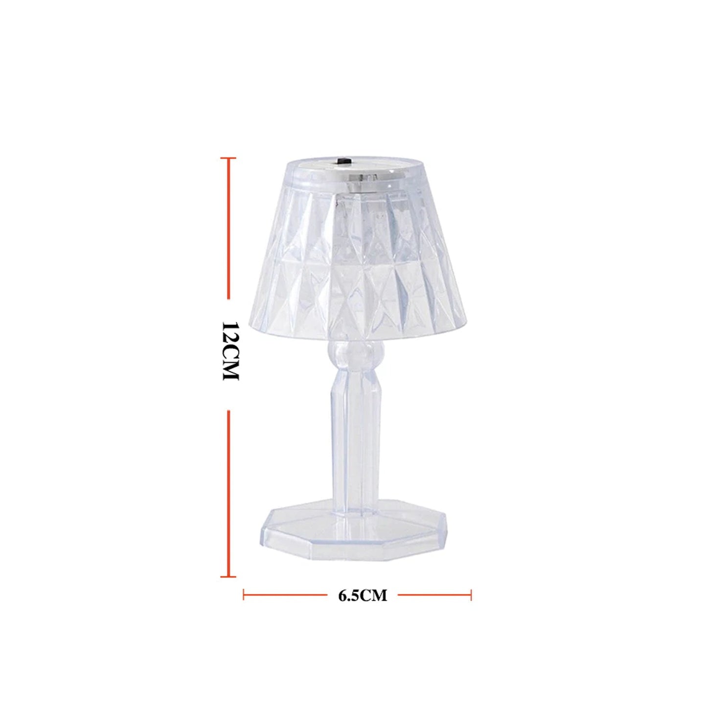 A modern mini crystal table lamp glowing softly in a contemporary interior.
