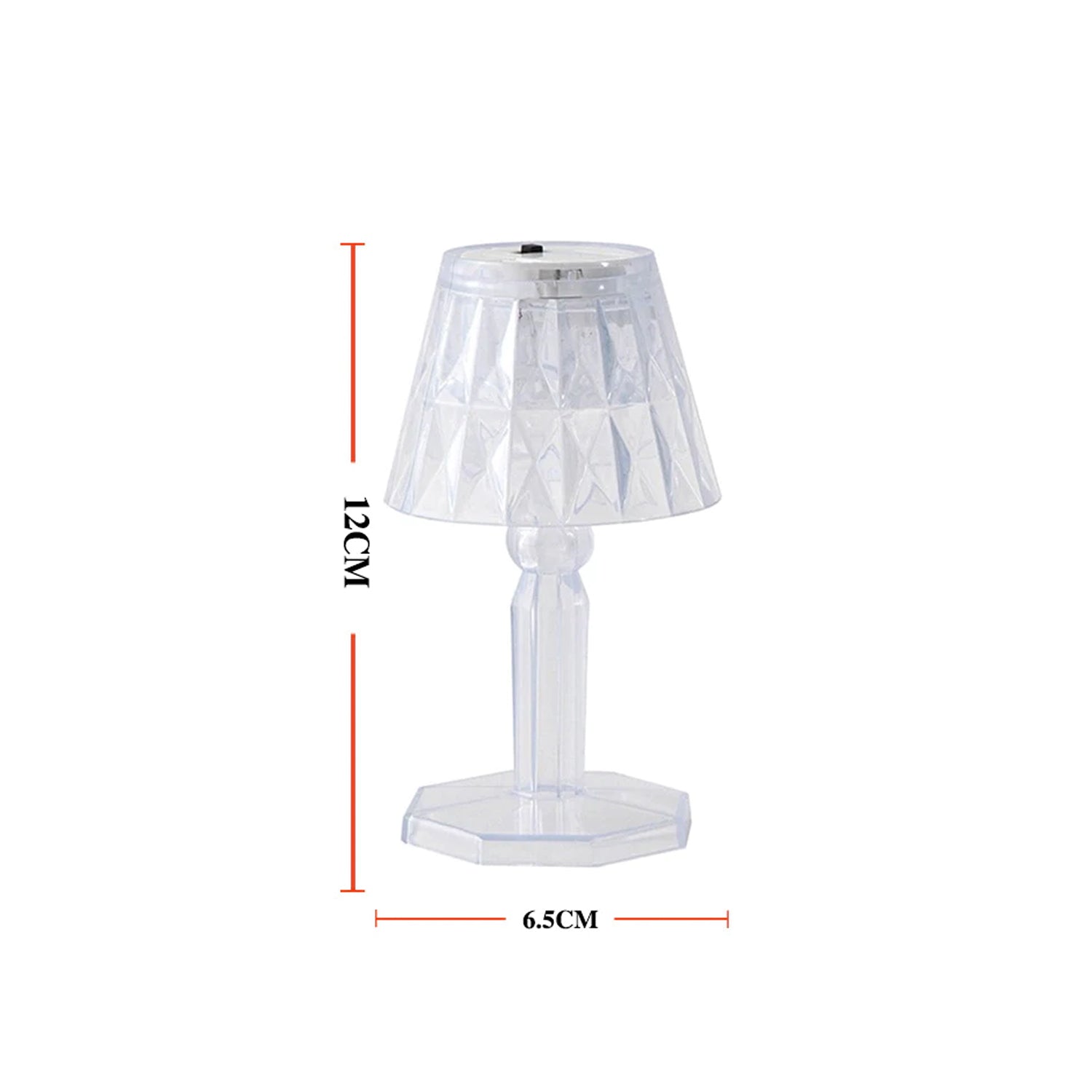 A modern mini crystal table lamp glowing softly in a contemporary interior.