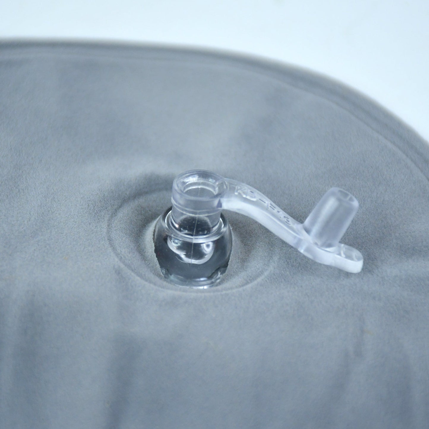 Close-up of features on inflatable travel pillow