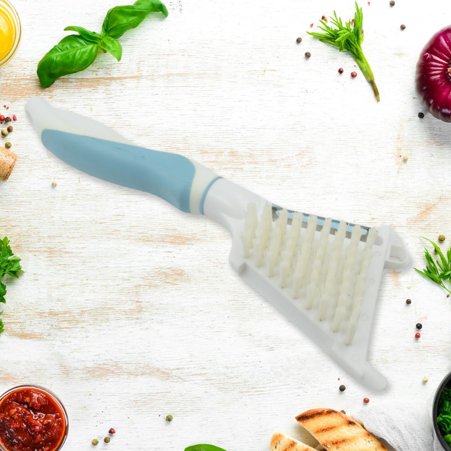 Side view of the stainless steel peeler brush, highlighting its compact design.