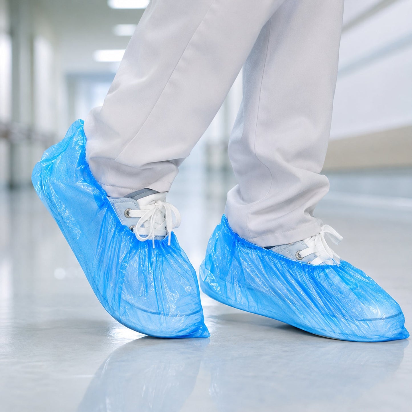 Various lightweight blue disposable shoe covers displayed.