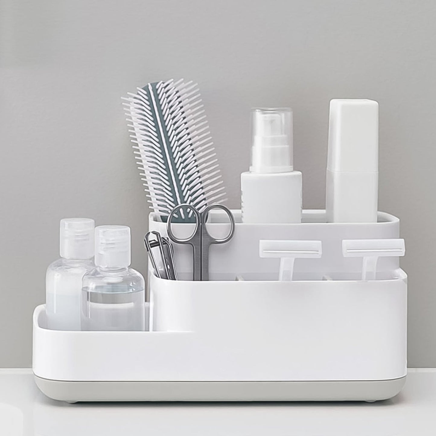 Close-up view of the versatile compartments of the plastic desk organizer.