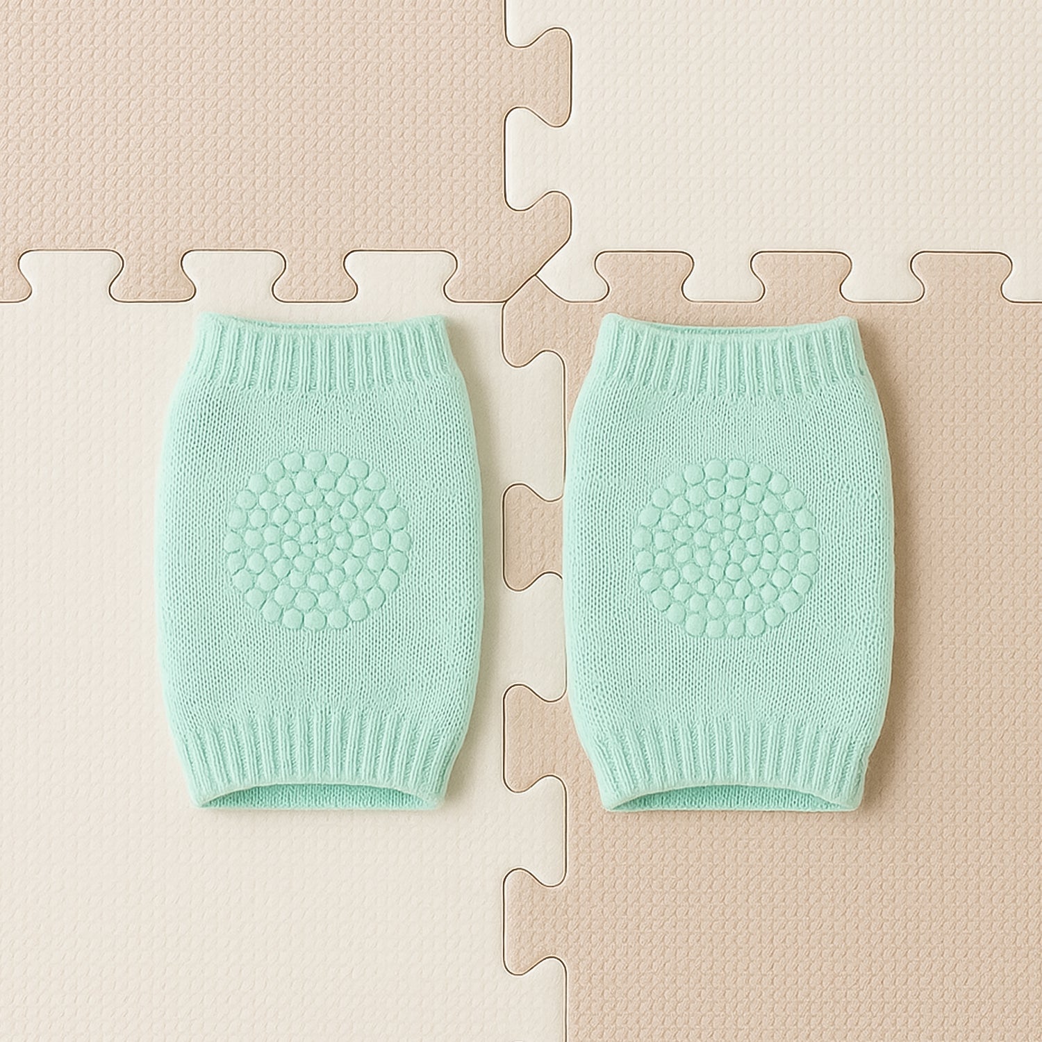 Close-up of soft mint green wool toddler knee protector leg warmers