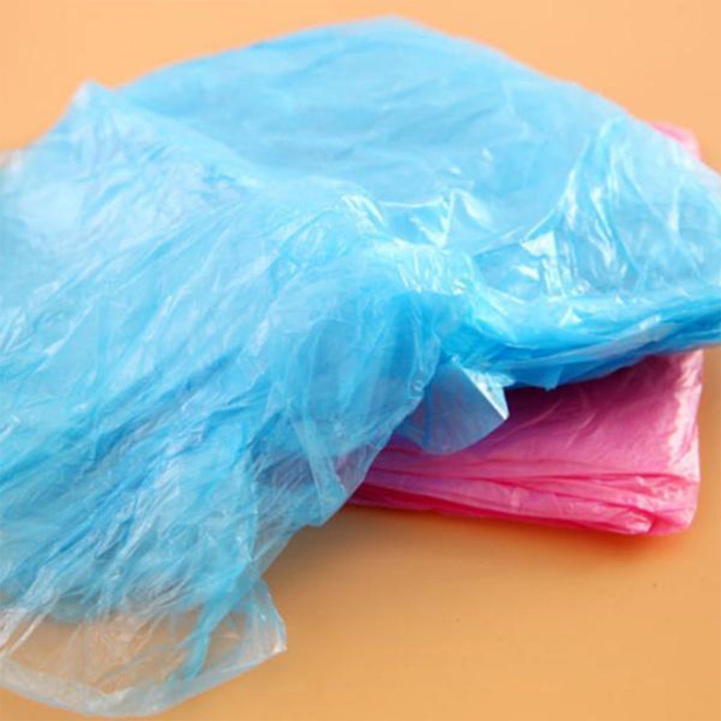 Travel-friendly disposable raincoat in compact packaging, easy to carry.