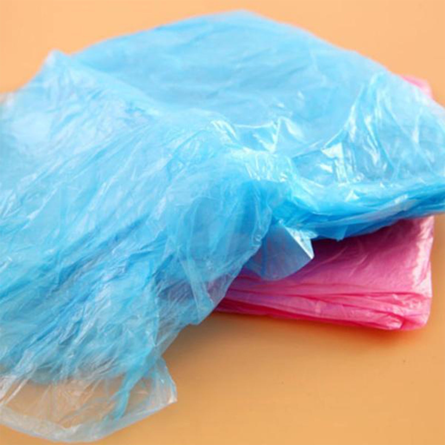 Travel-friendly disposable raincoat in compact packaging, easy to carry.