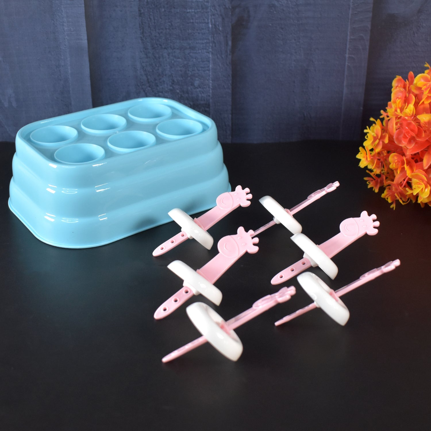Frozen giraffe-shaped popsicles made using plastic molds