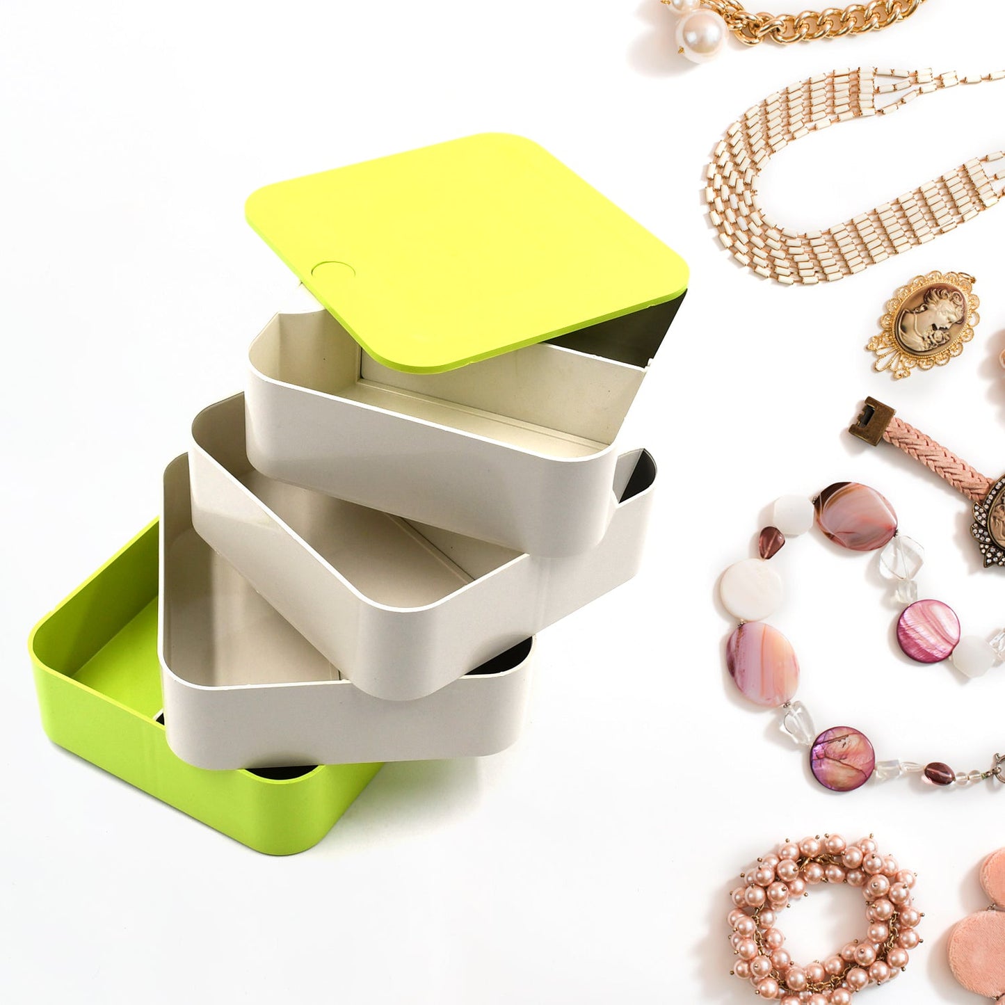 Elegant 4-layer Rotating Jewelry Box in white, ideal for storing earrings and rings.