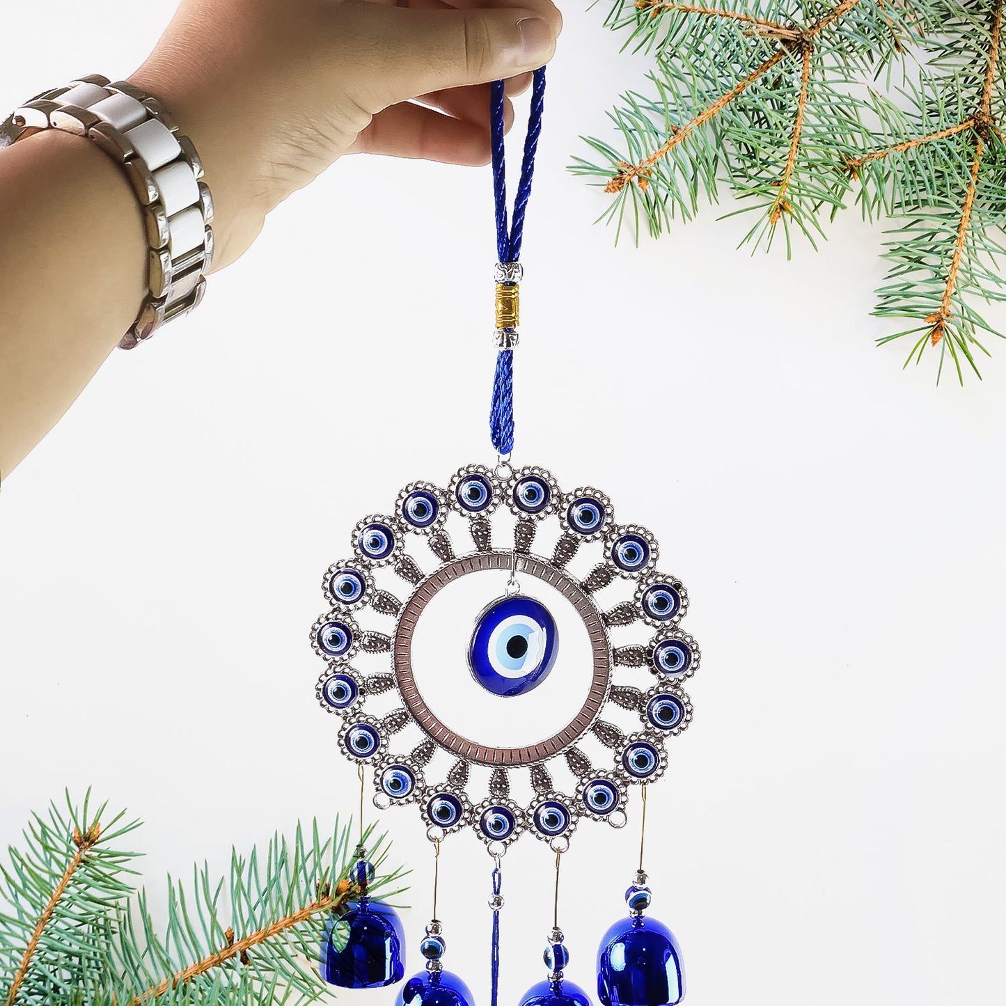 Blue metallic bells on Om Evil Eye decorative wind chime