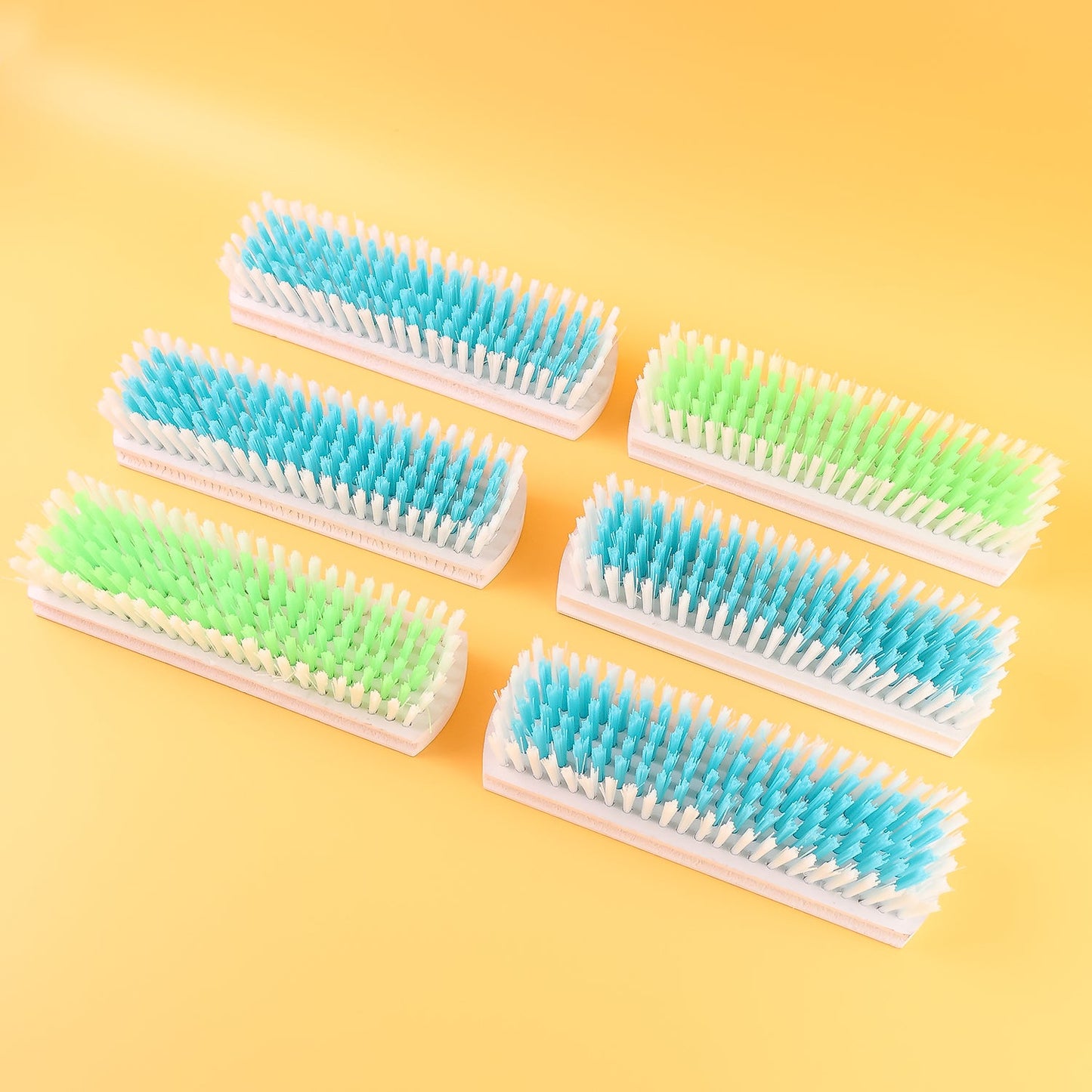 Household scrub brushes with strong bristles and wooden handles