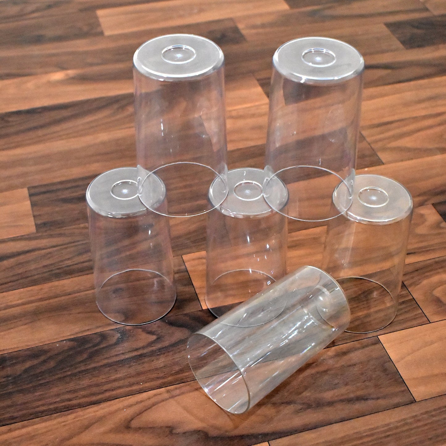 Lifestyle image of the Ganesh Classic plastic glasses set being used in a home setting.