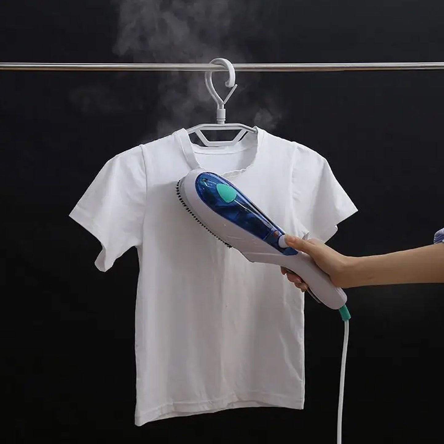 Portable Garment Steamer in use, quickly removing wrinkles from clothing.