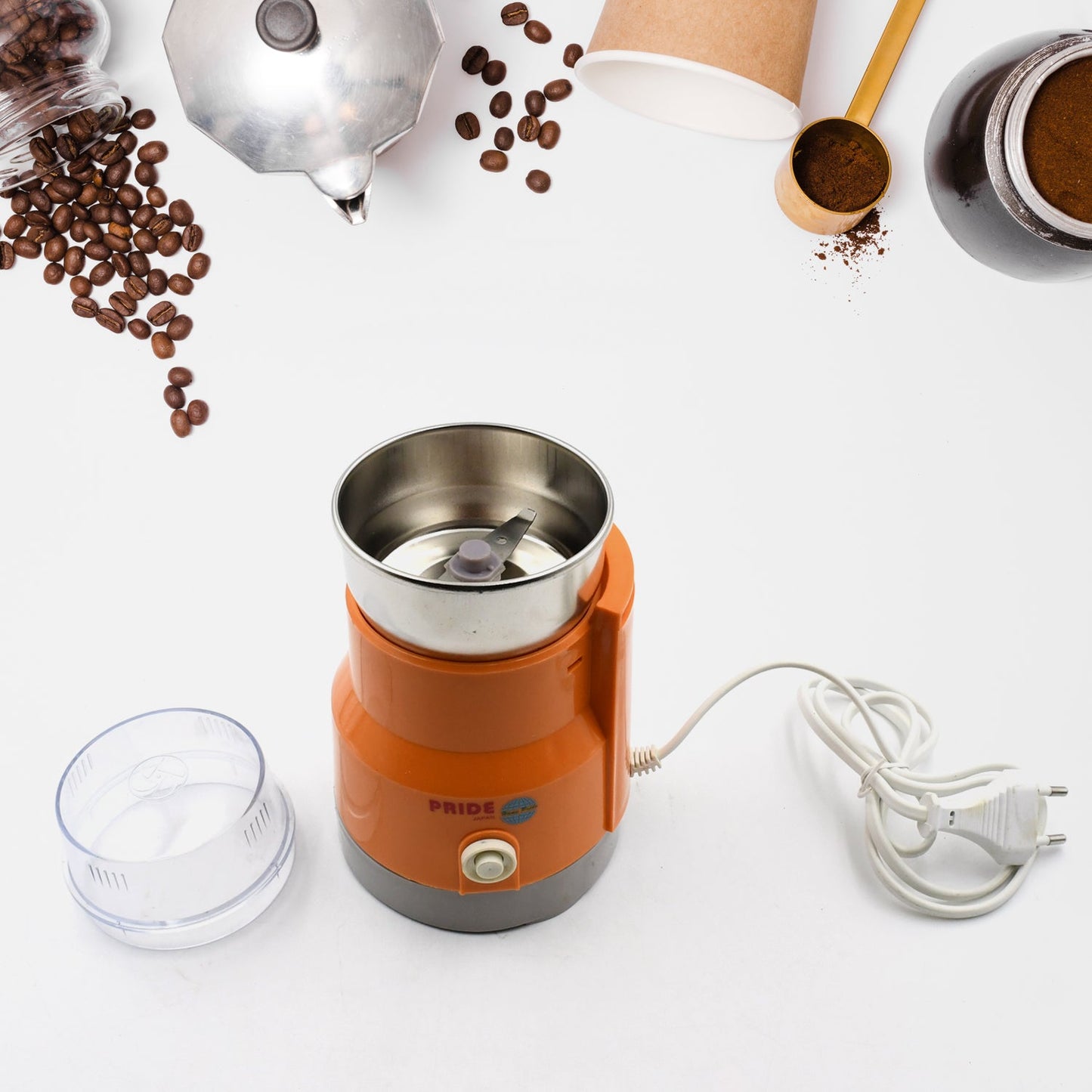 Small kitchen grinder with transparent lid for easy monitoring.