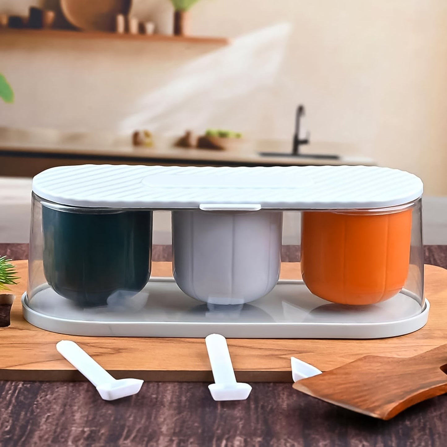 Top-down view of the 3-grid spice box kit, showcasing its clear lid and neatly arranged spoons.