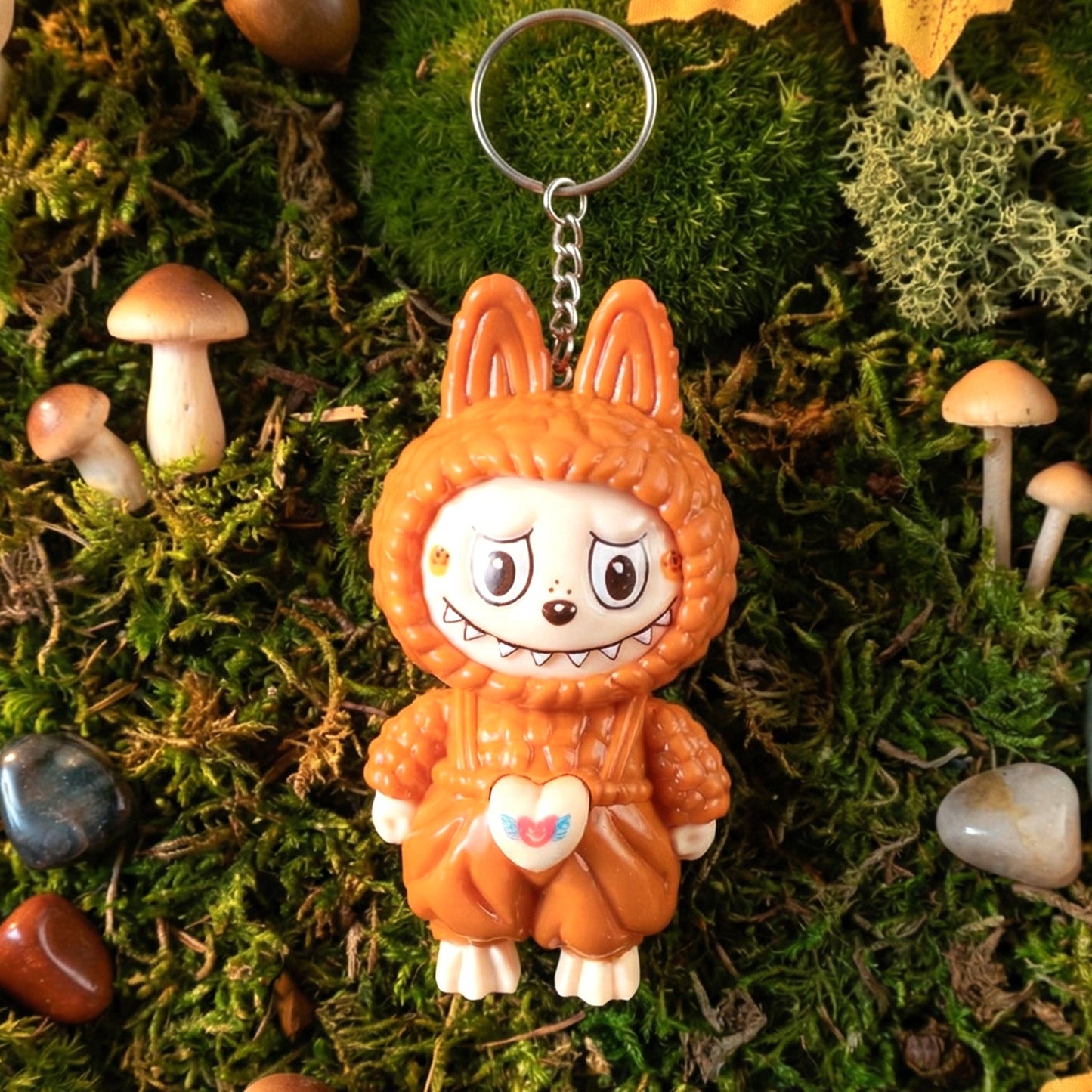 Face changing cartoon toy keychain with attached keyring