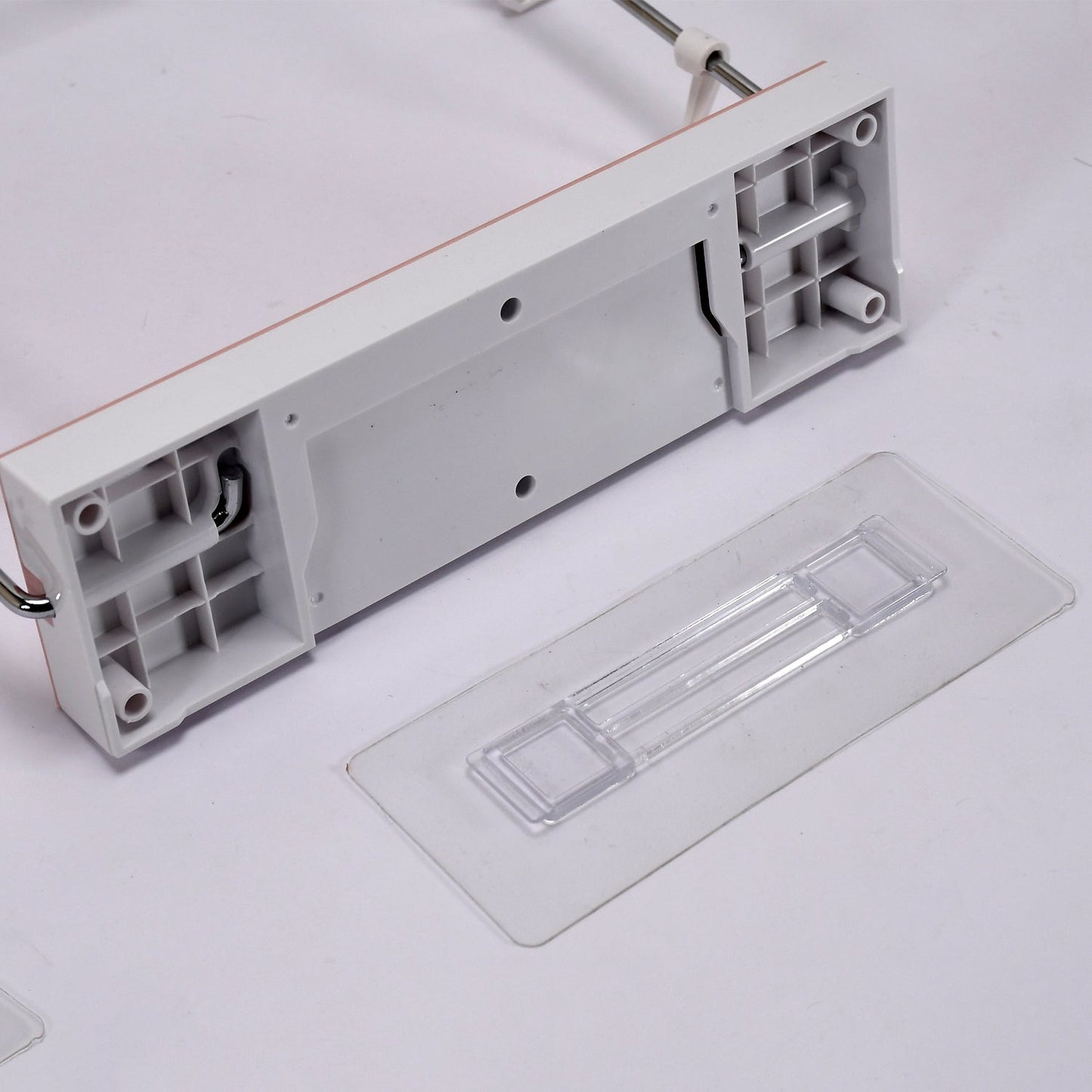 Side profile of the foldable wash basin rack, highlighting its compact design.