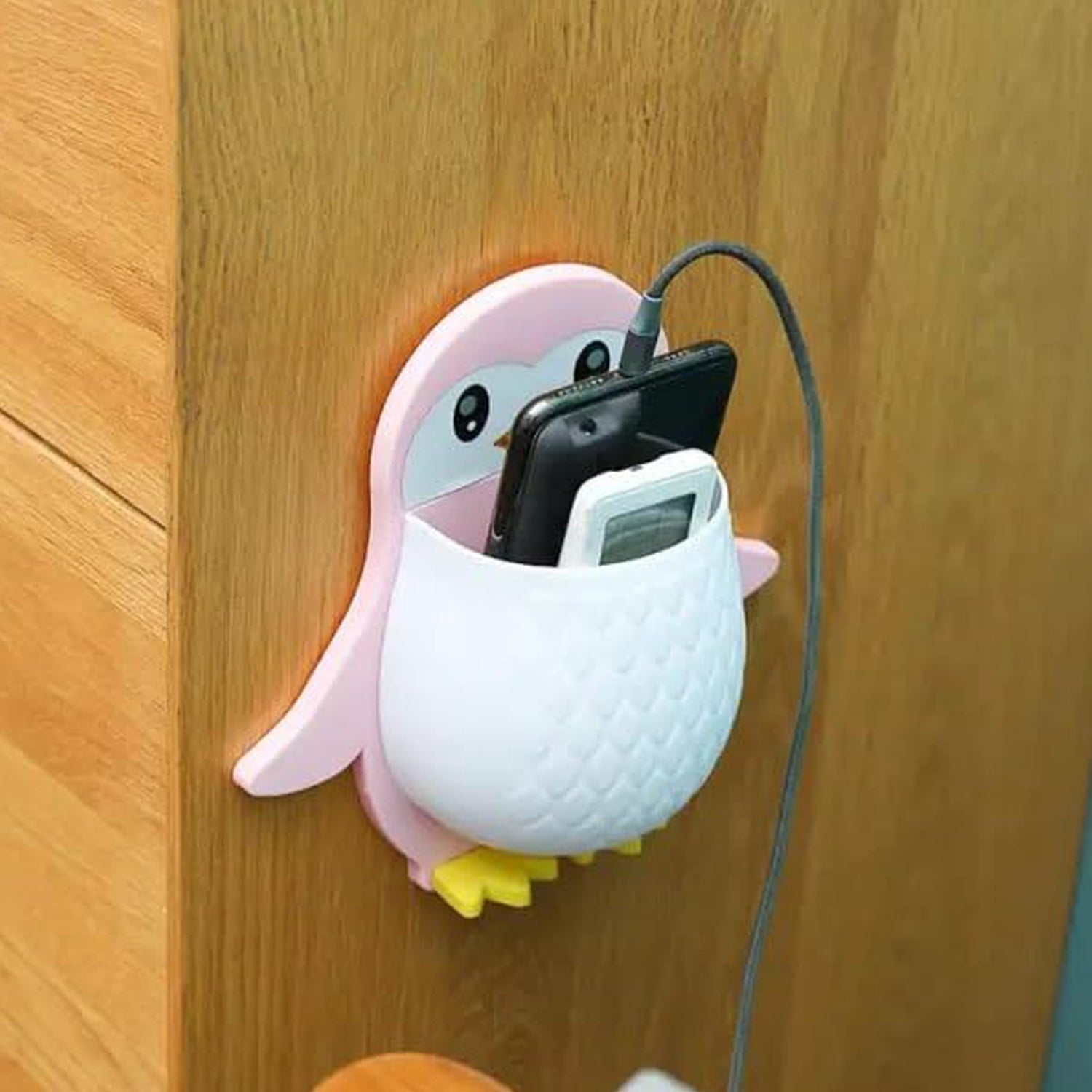 Close-up of VoltDesk Penguin storage box with remote control inside