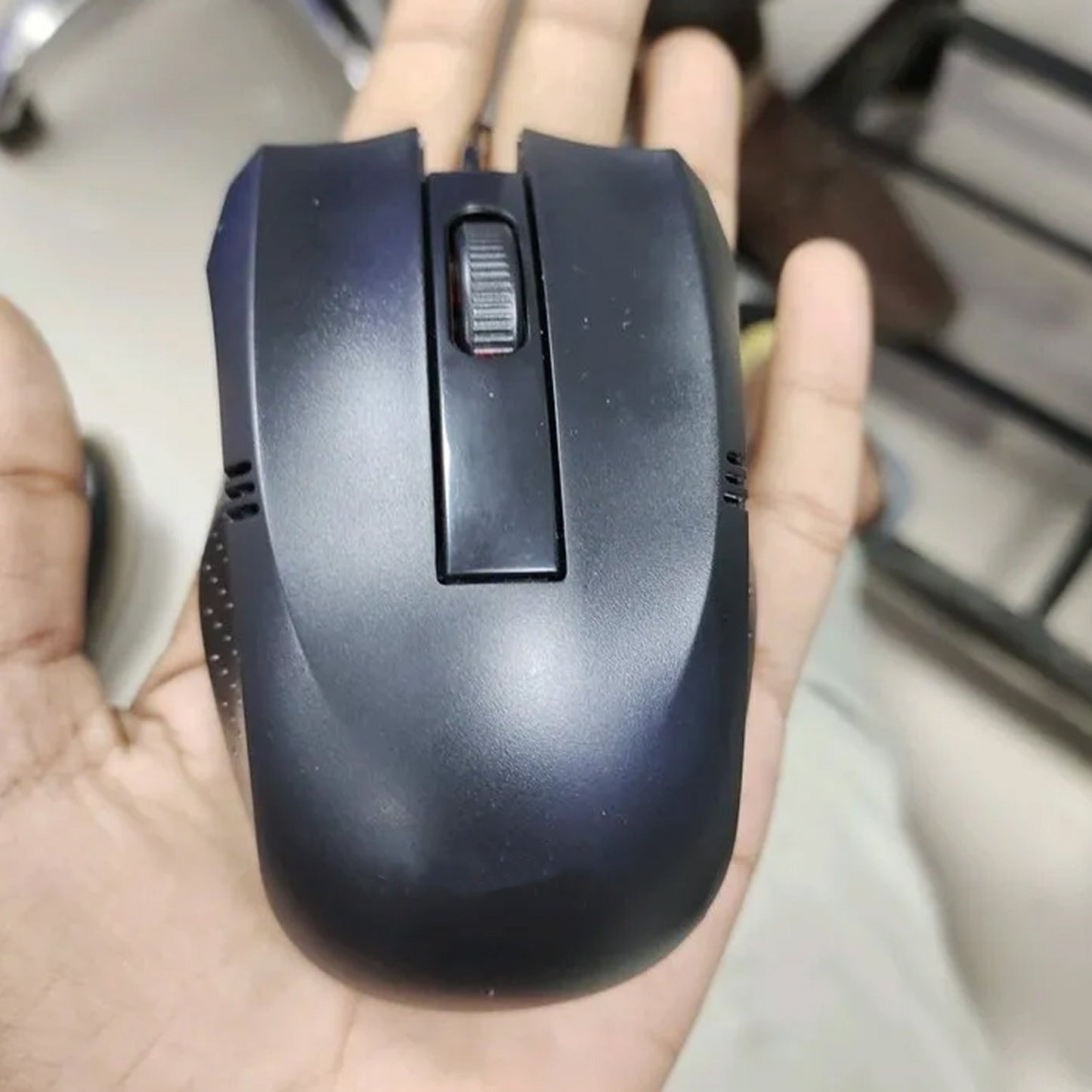 Top-down view of the sleek wired optical mouse, highlighting its simple and functional design.