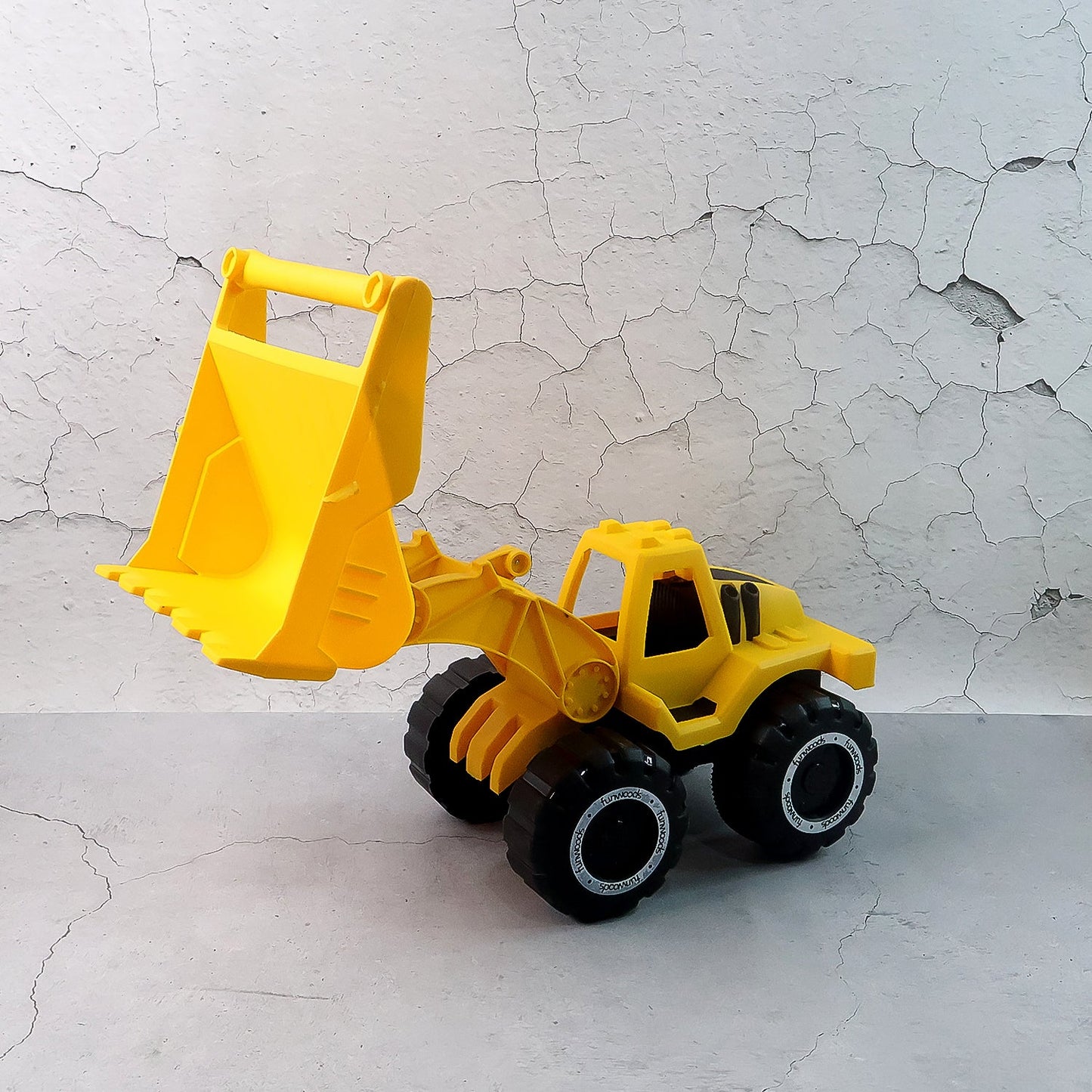 Bulldozer toy on play mat