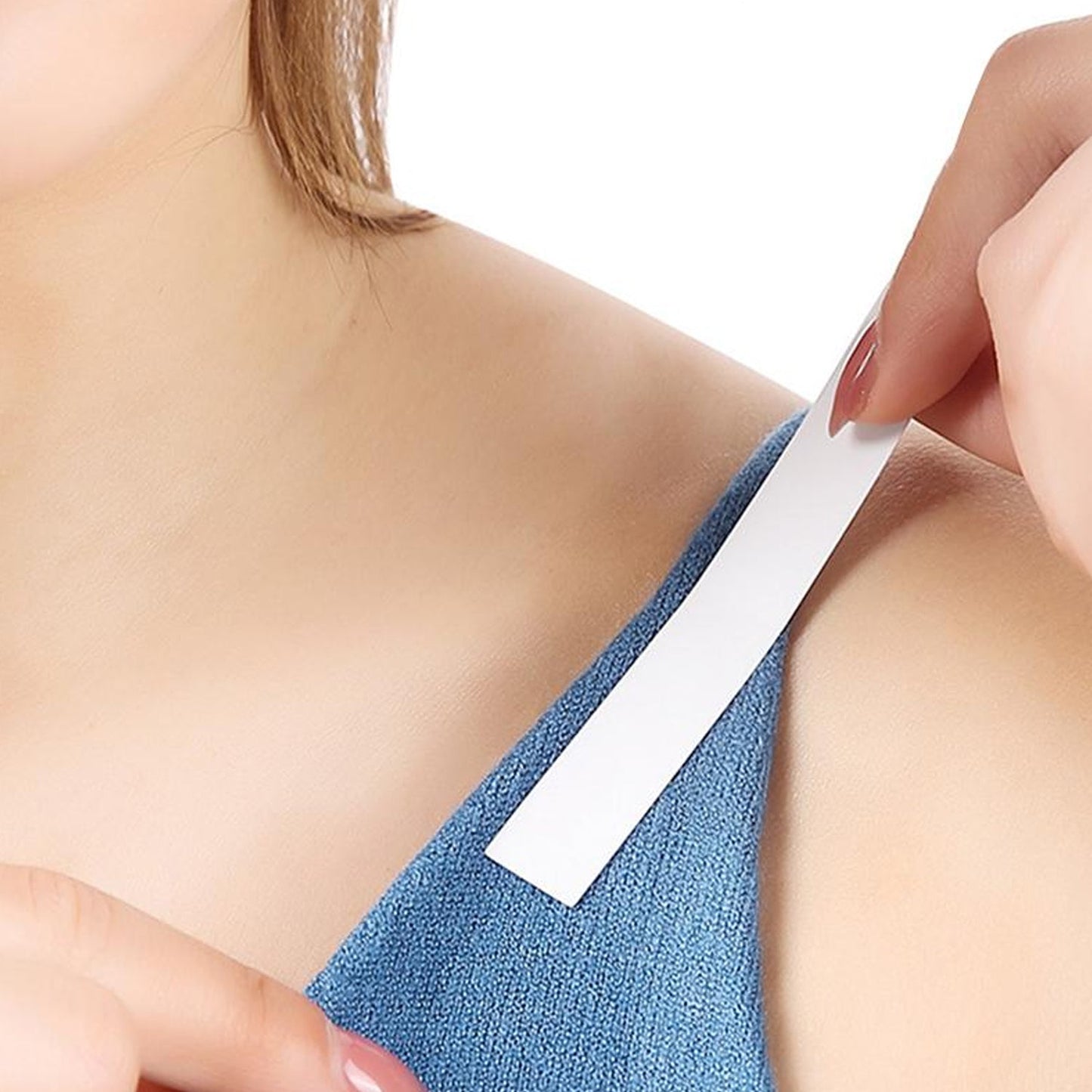 Detailed view of the skin-friendly adhesive side of the clear fashion tape.